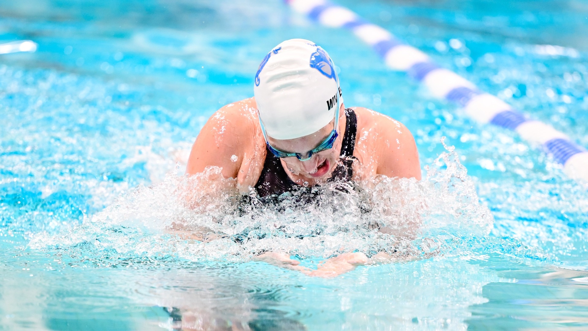 Quinci Wheeler competes in the breaststroke in Tufts' meet against Bates.