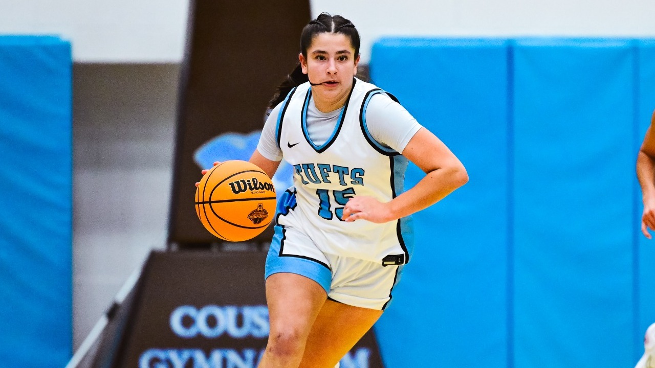 Tessa Lozner Dribbles Against MIT at Cousens Gymnasium.