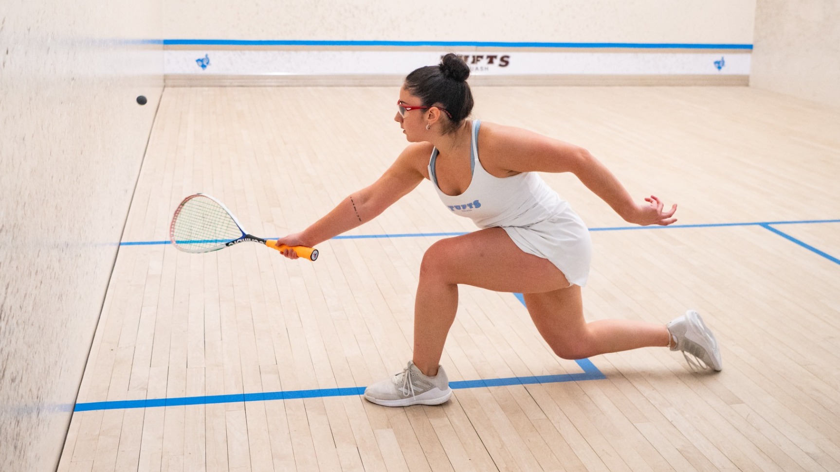 Mafi Pinot Hits Shot Against Conn. College in Tufts Squash Center.