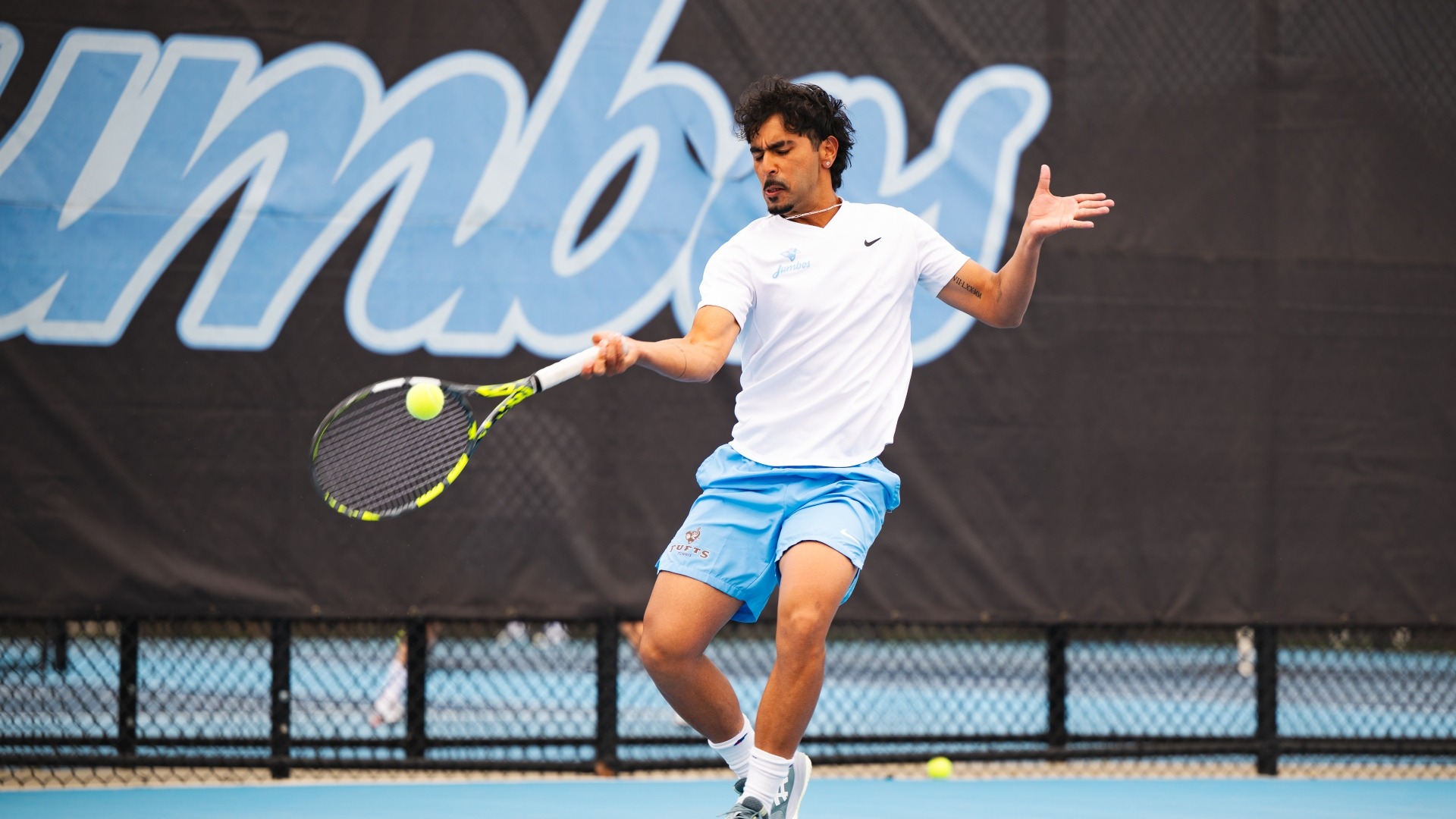 Garv Bahl returns a shot in a match at the Tufts Tennis Center.
