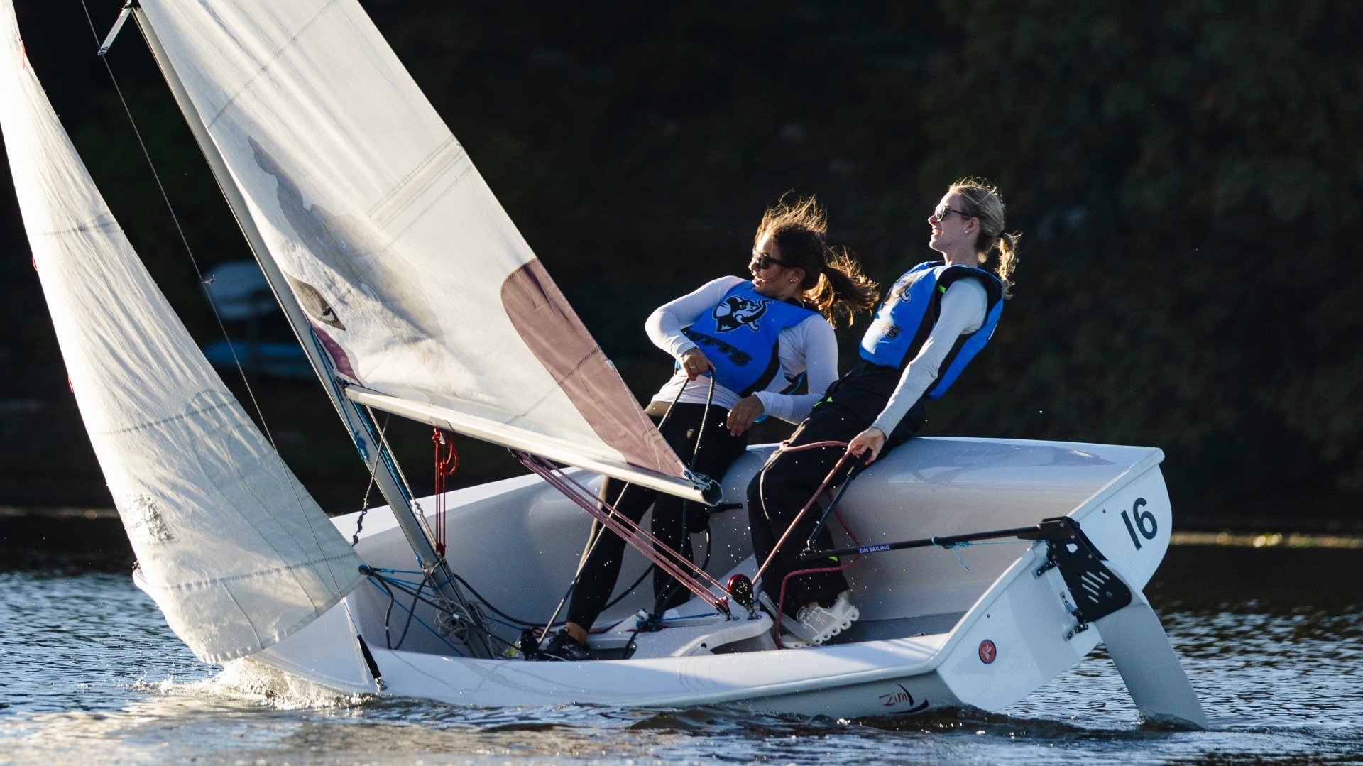 Tufts sailors Maddie Janzen and Eloise Goedkoop in a 420 dinghy during a practice session.