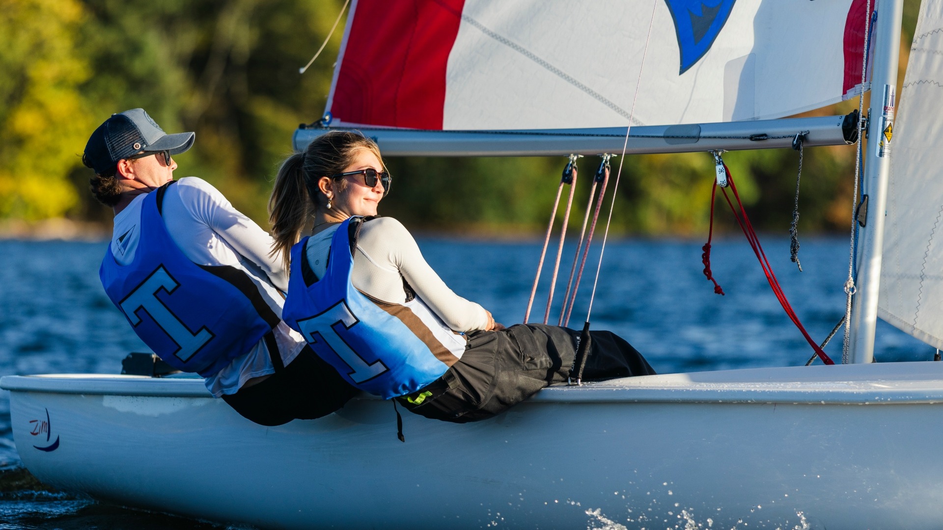 Pearse Dowd and Sophie Dart compete at Upper Mystic Lake at practice.