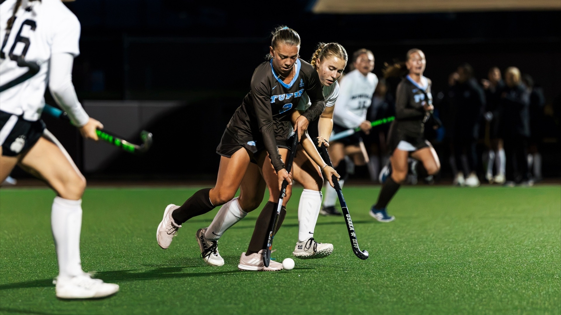 Eleanor Helm controls the ball against a Bowdoin defender.