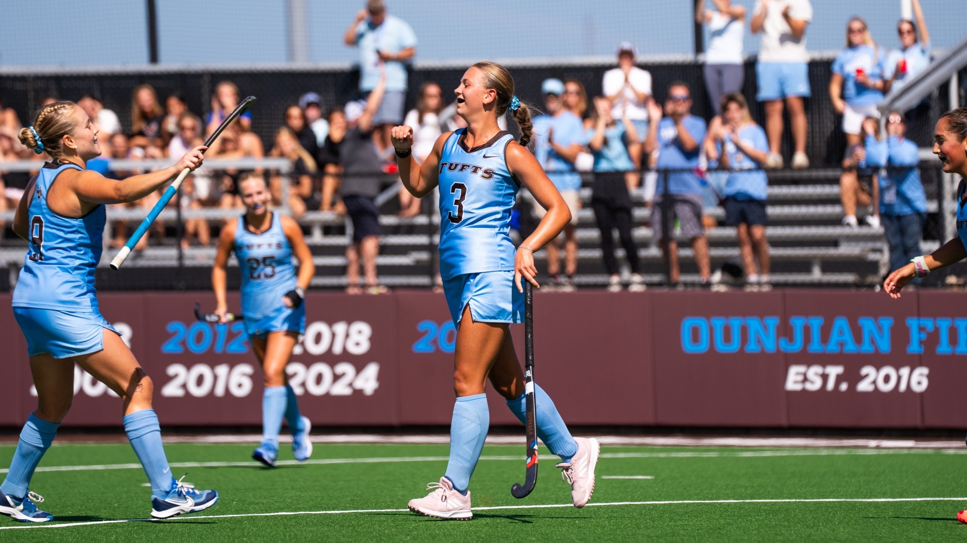 Eleanor Helm celebrates a goal score against Colby College.