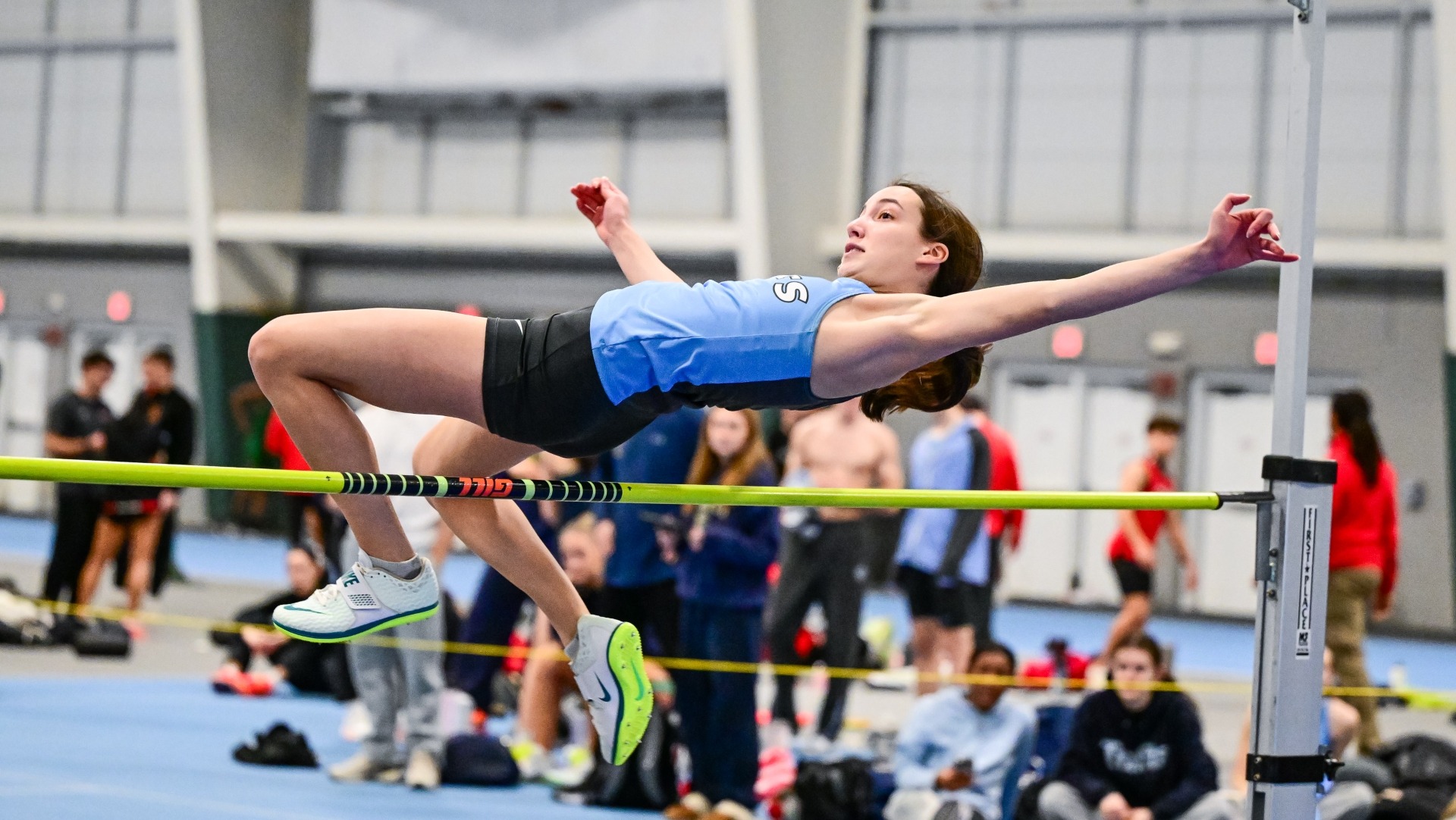 Eleanor Lewis competes in the high jump at the Gantcher Center.