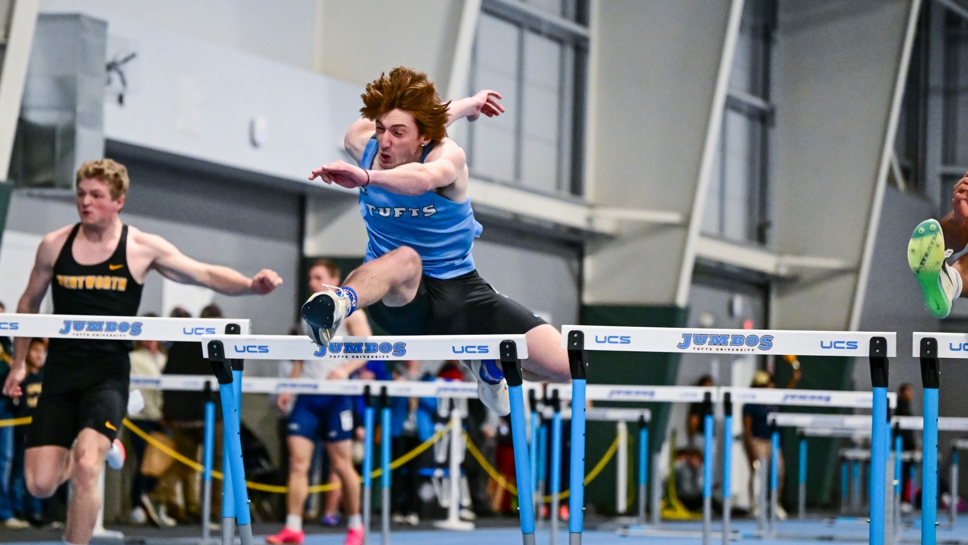 Kropiwnicki competes in the hurdles event at the Gantcher Center.