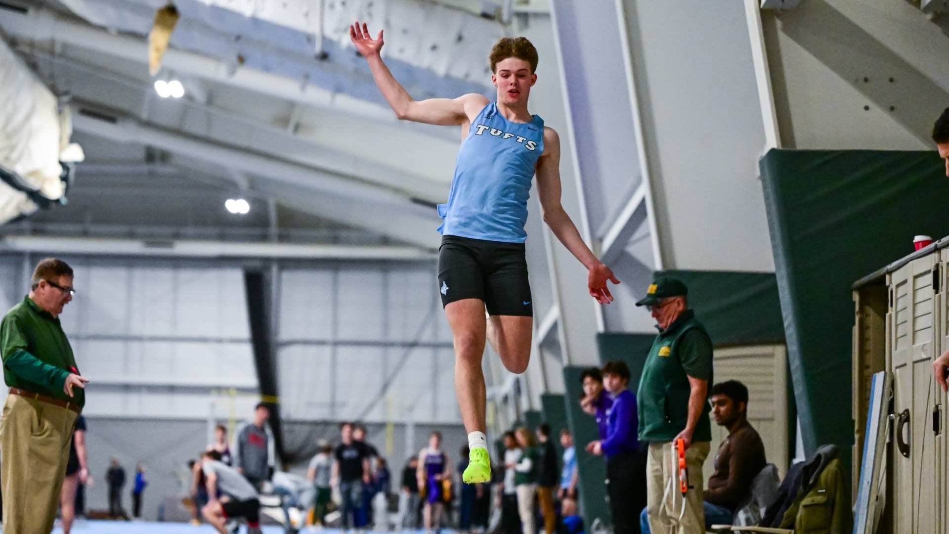 Luke Benson competes in the triple jump for the Jumbos.