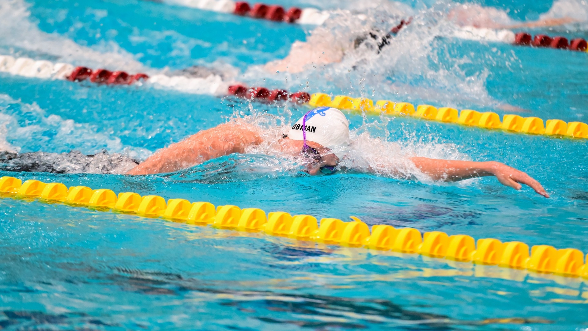 Ron Lyubman swims in a freestyle event for the Jumbos.