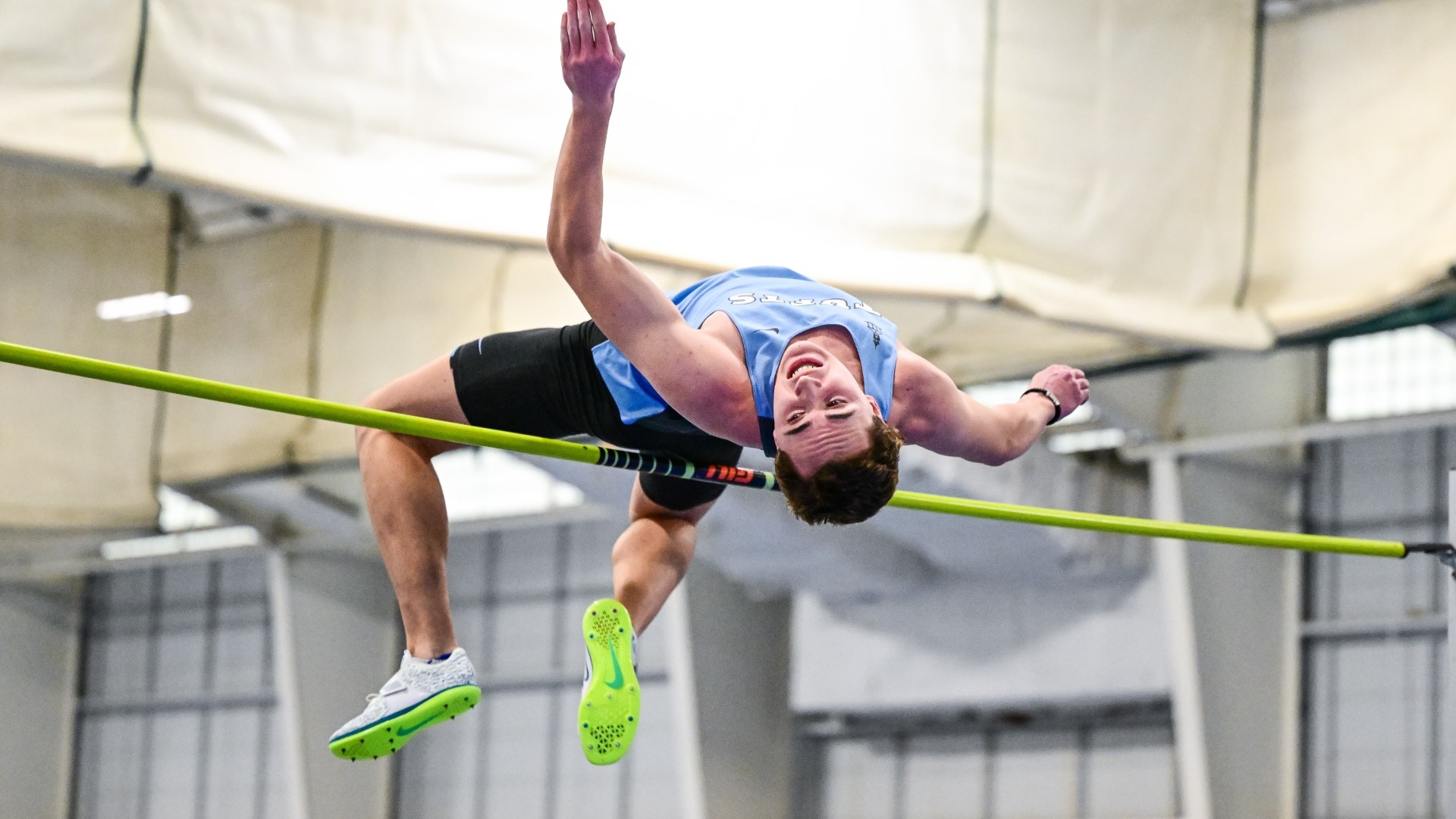 Tieren Mead clears the bar in the high jump at the Gantcher Center.