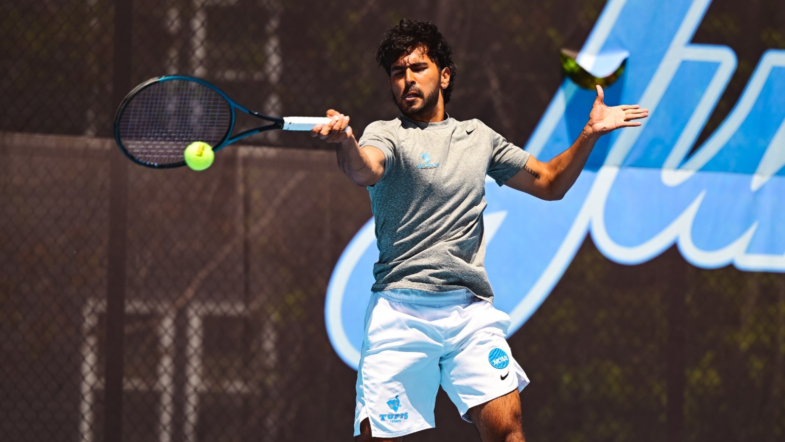 Garv Bahl Hits Shot for Tufts University Men's Tennis Team.