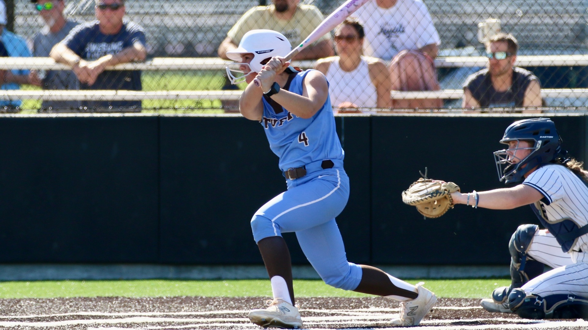Paige Murphy makes contact in Tufts' game against Bethel University.