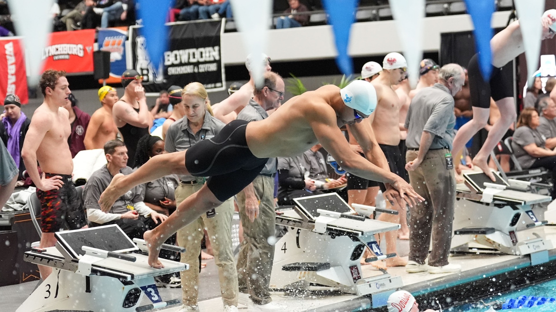 A member of Tufts' 200 freestyle relay takes off during the NCAA Championships.