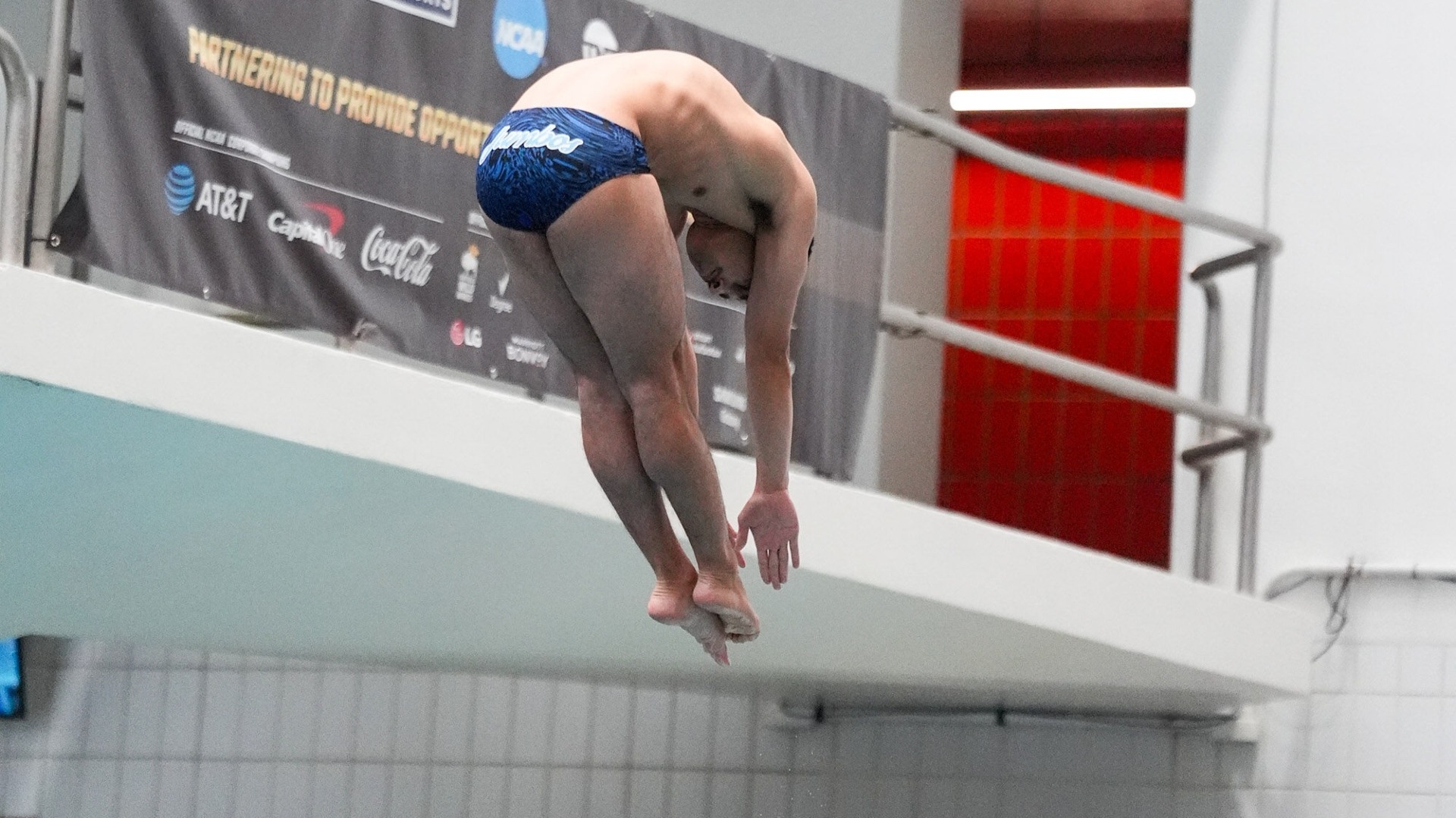 Jay Wilkinson performs a dive off the one-meter board at the NCAA Championships.