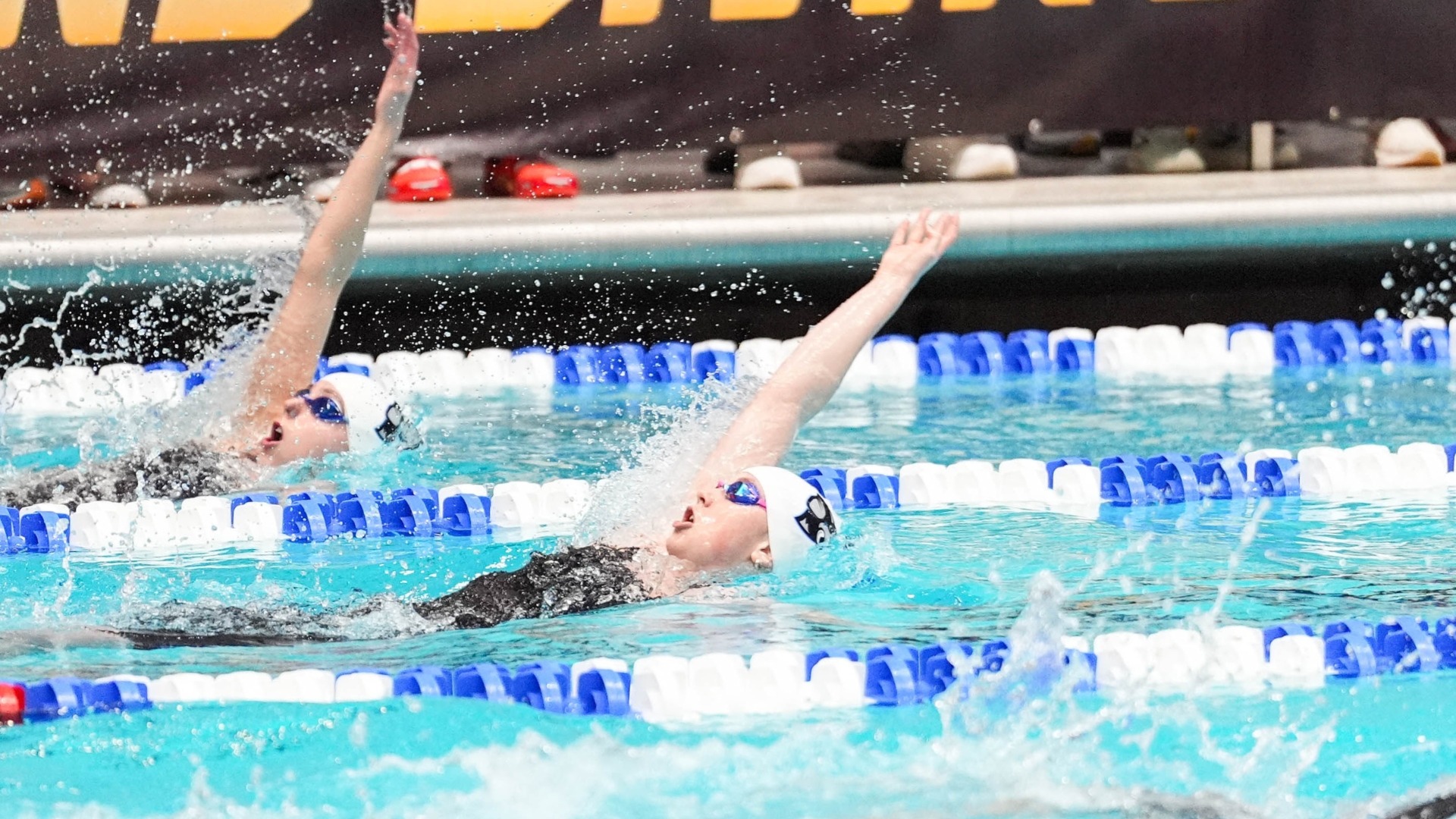 Two Jumbos swim in the 200 backstroke at the NCAA meet.