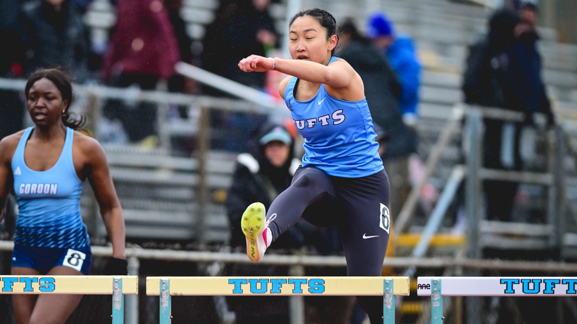 Paige Zhang races in the hurdles at Ellis Oval.