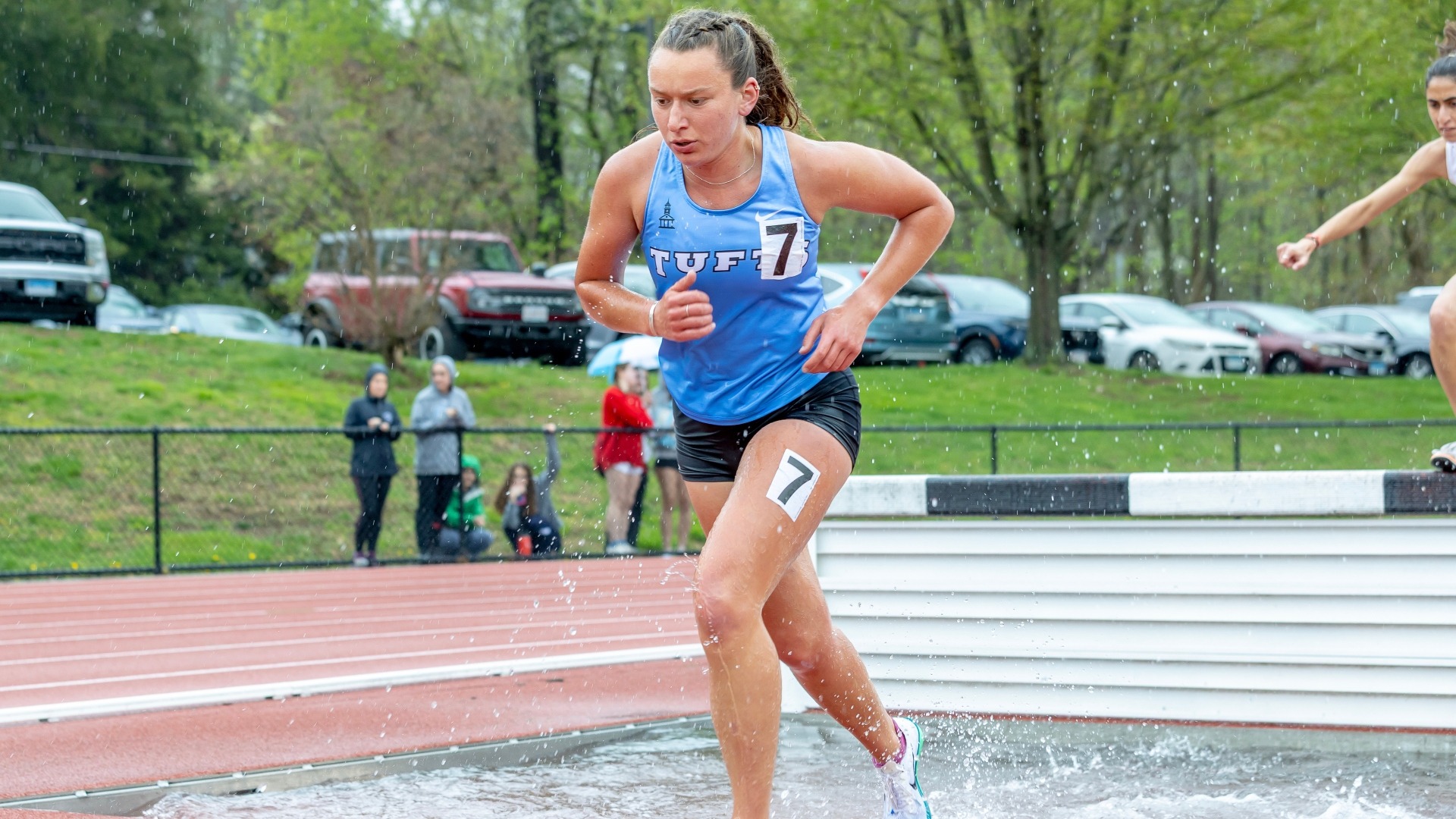 Lexi Dean runs in the 3000-meter steeplechase at the 2025 NESCAC meet.