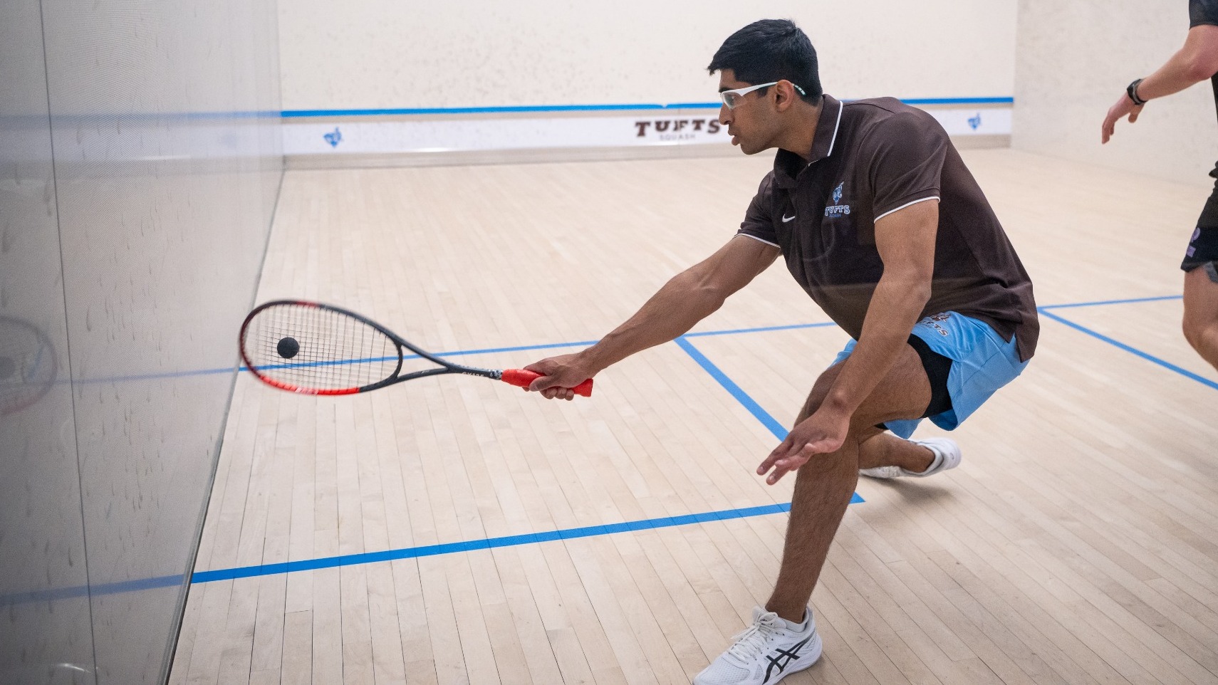 Rohan Valia Hits Shot for Tufts Men's Squash.
