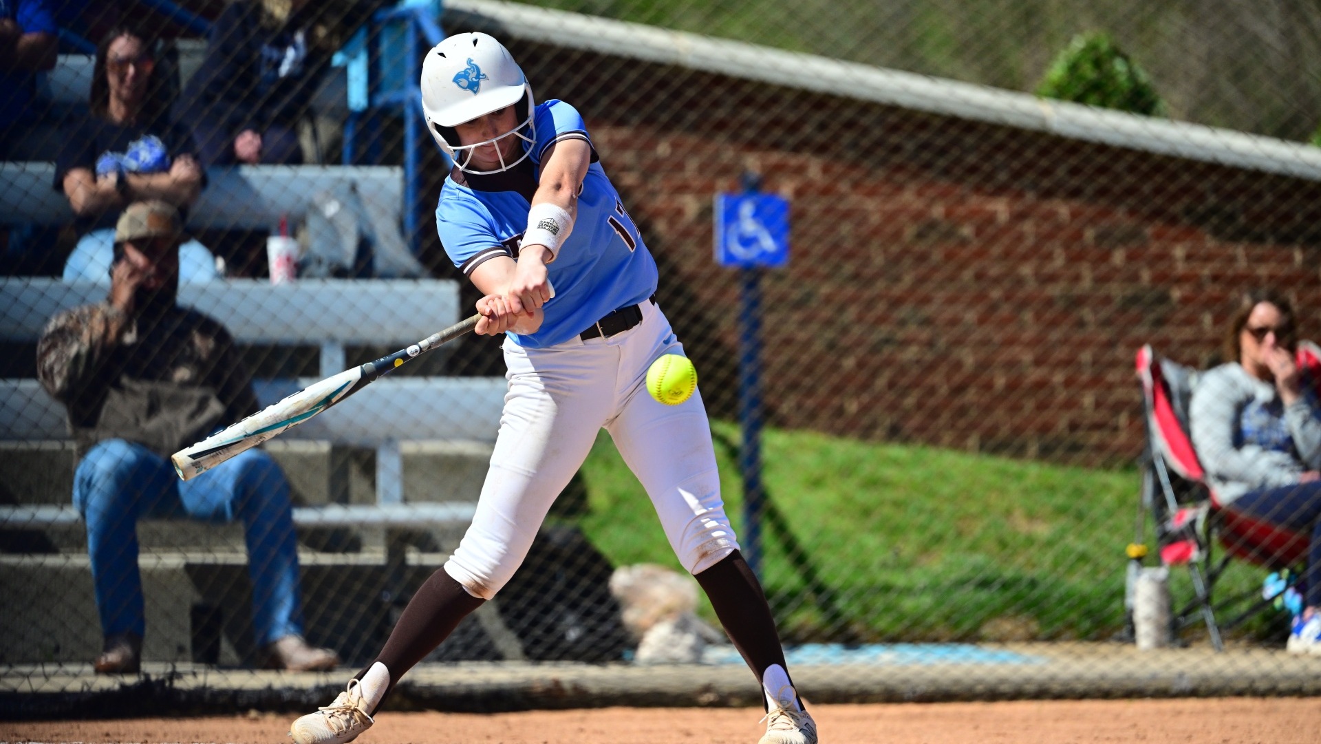 Kaitlyn Perucci makes contact at Christopher Newport University.