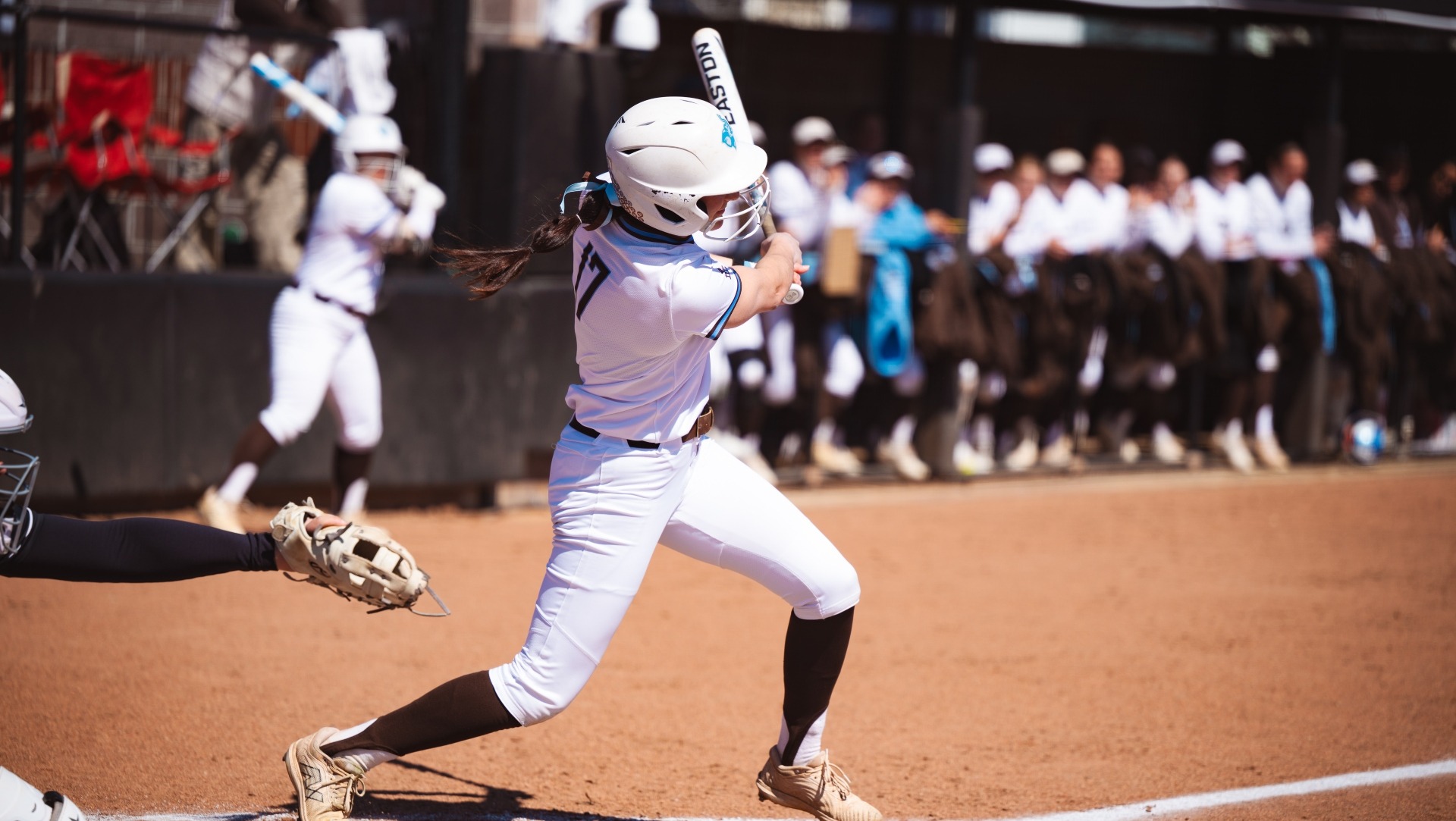 Kaitlyn Perucci follows through on an at bat against Bates College.