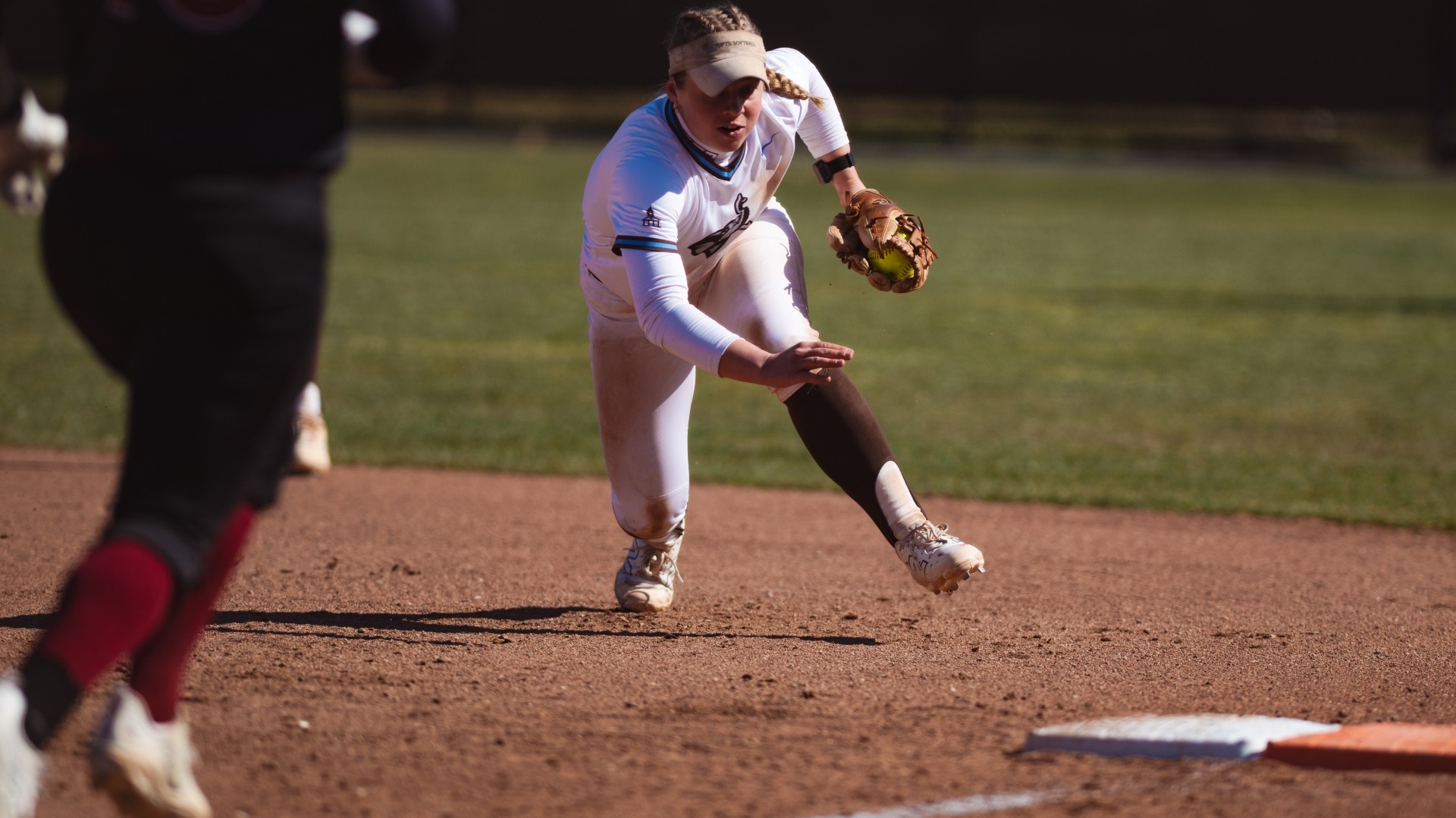 Haley Leimbach beats a runner to first base during the team's games against Bates.