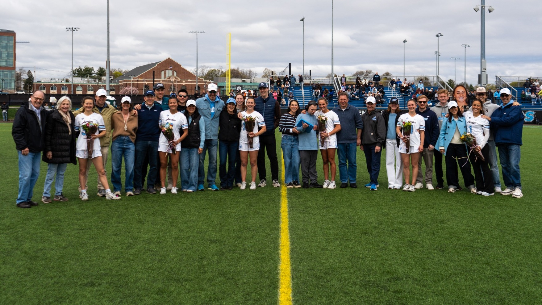 Senior Day Photo Of Tufts Women's Lacrosse Seniors and Families on Bello Field April 18, 2026