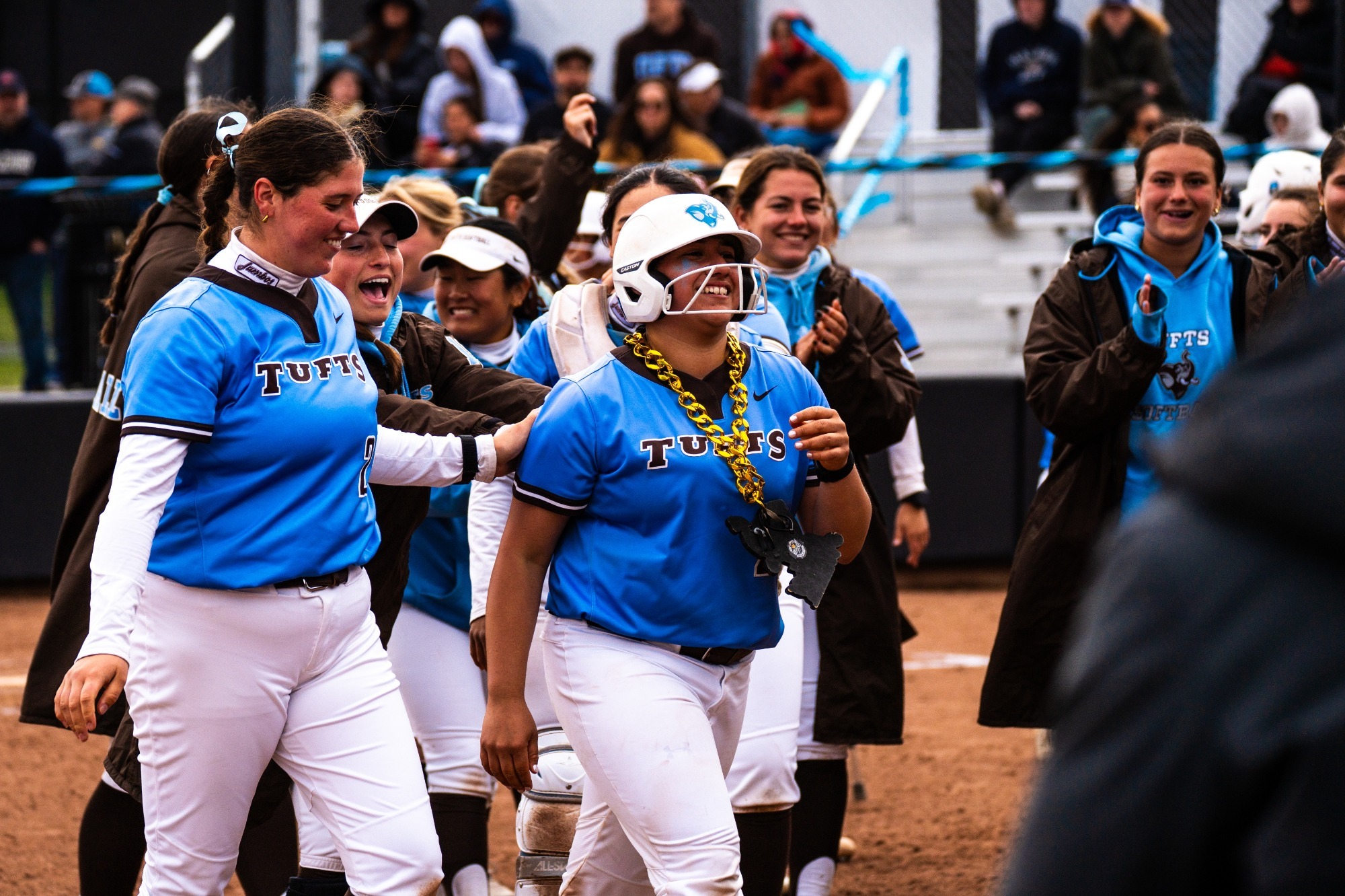 The Jumbos celebrate a home run by Heaven Oliva in the Middlebury series.