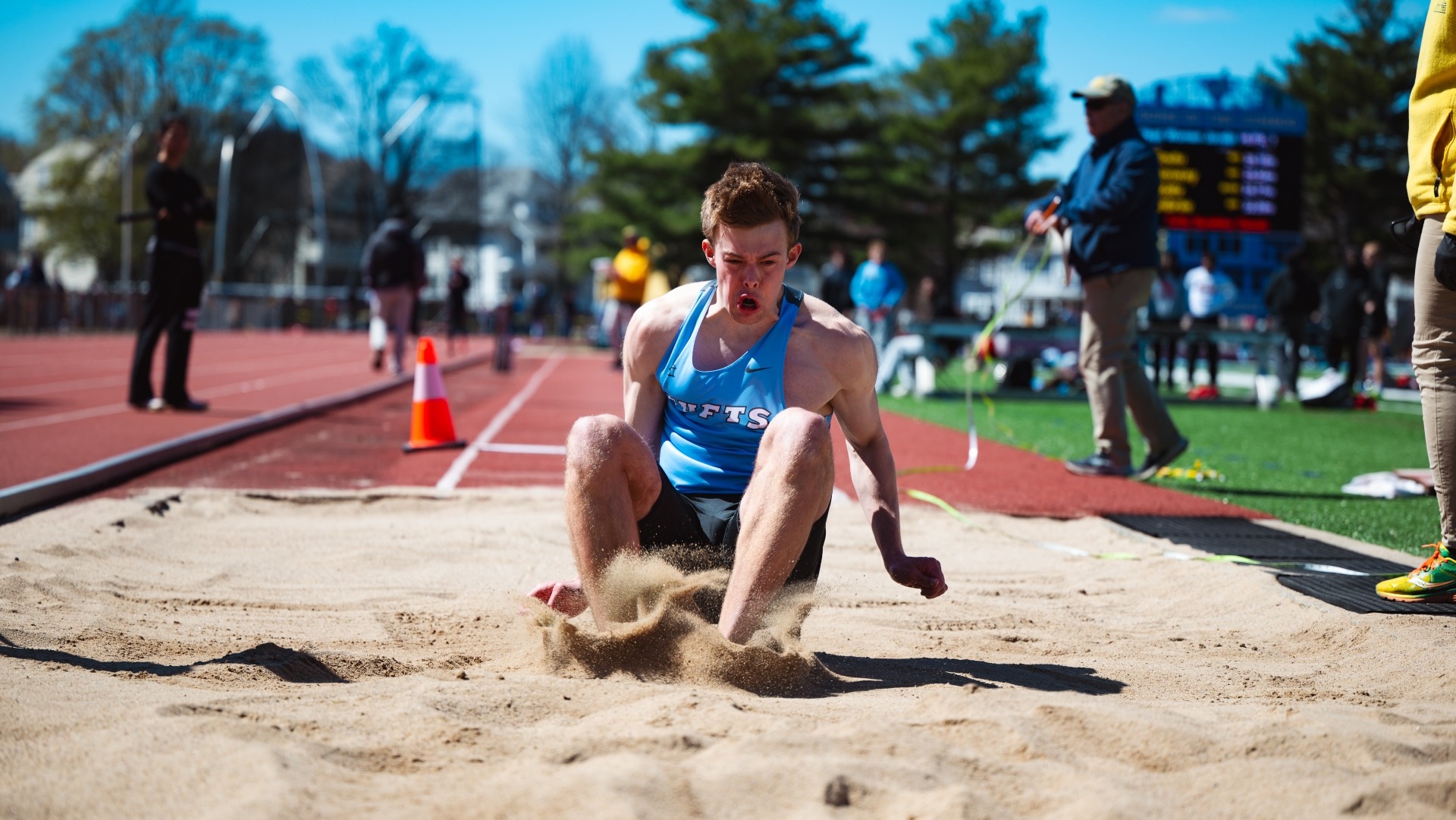 Luke Benson lands his jump during the Tufts Spring Invitational at Ellis Oval.