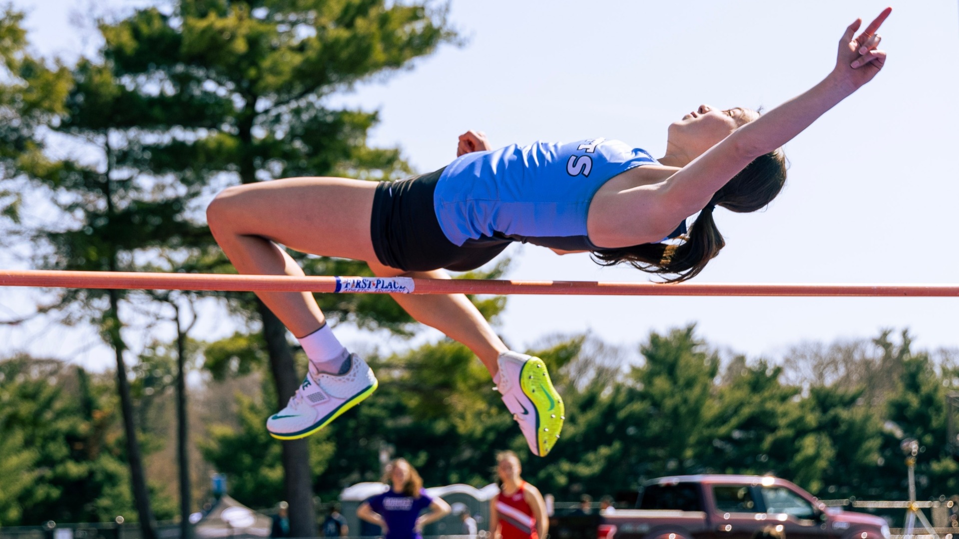 Eleanor Lewis clears the bar in the high jump at the Tufts Spring Invitational.