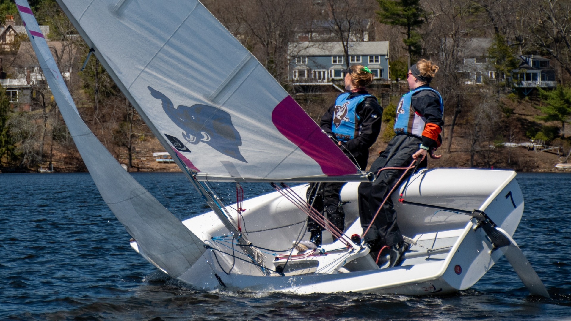 Ella Hubbard and Kate Castleberry compete at the New England Team Race on Upper Mystic Lake.