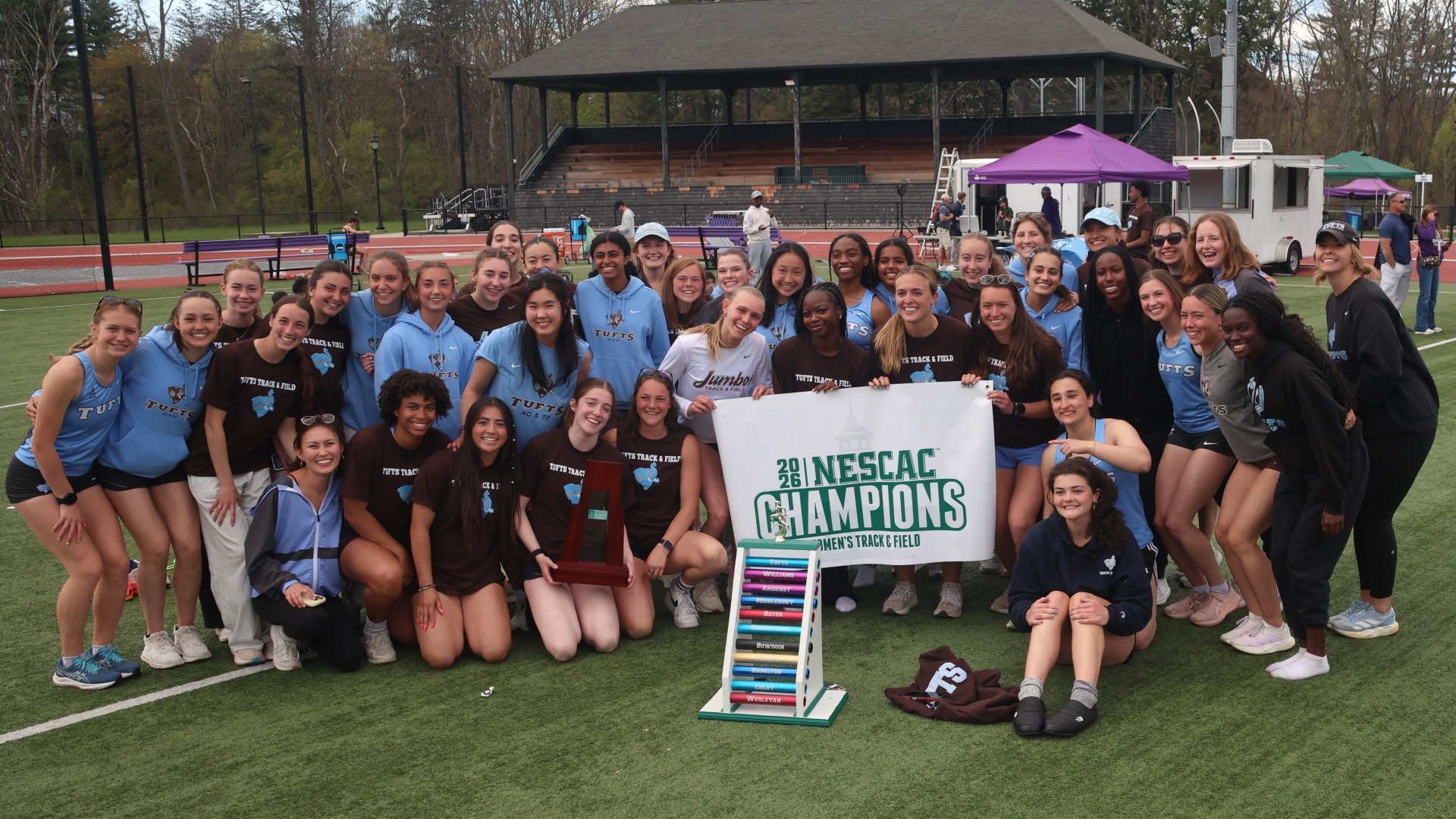 The Tufts women's outdoor track & field team celebrates its 2026 NESCAC Championship.