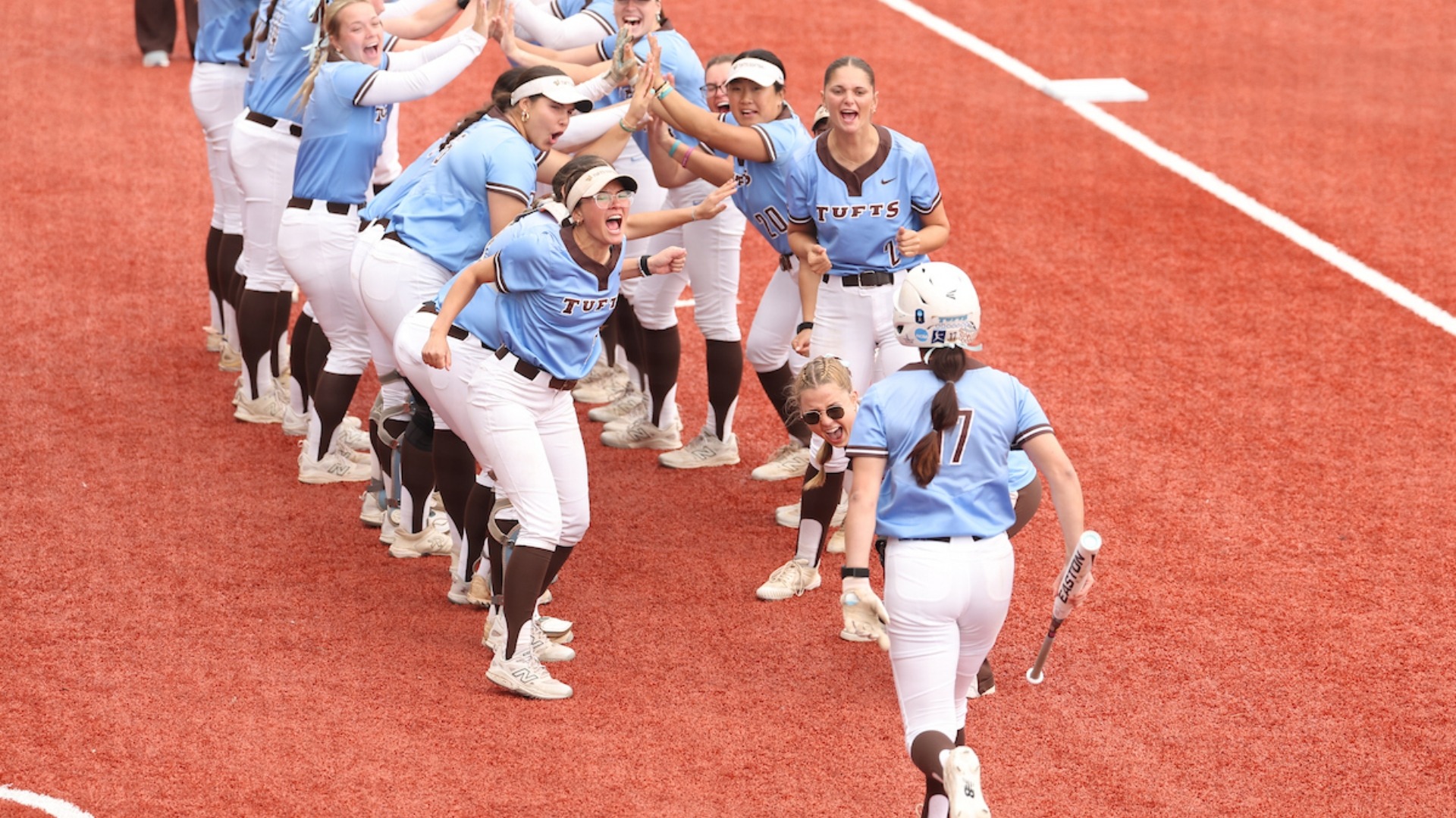 The Jumbos celebrate a home run by Kaitlyn Perucci in the NESCAC semifinals.