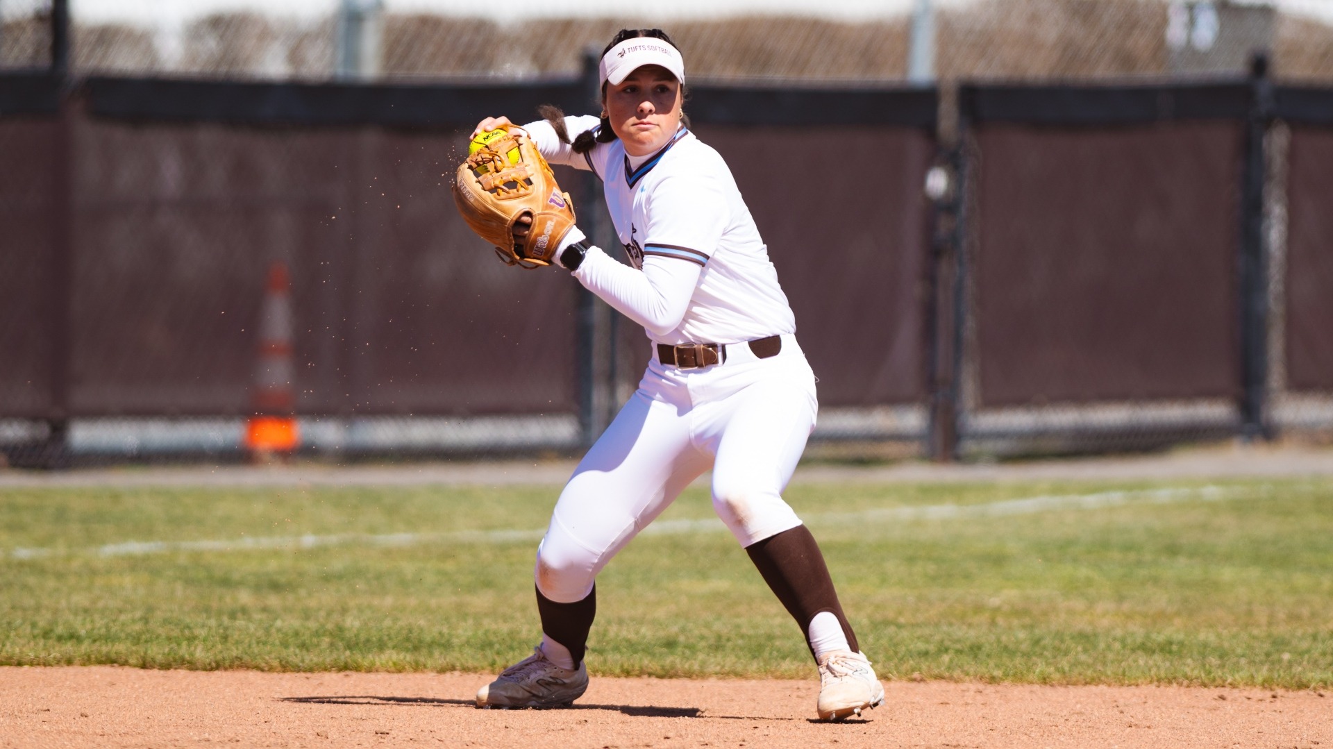 Paige Murphy prepares to make the throw across the diamond from her shortstop position.