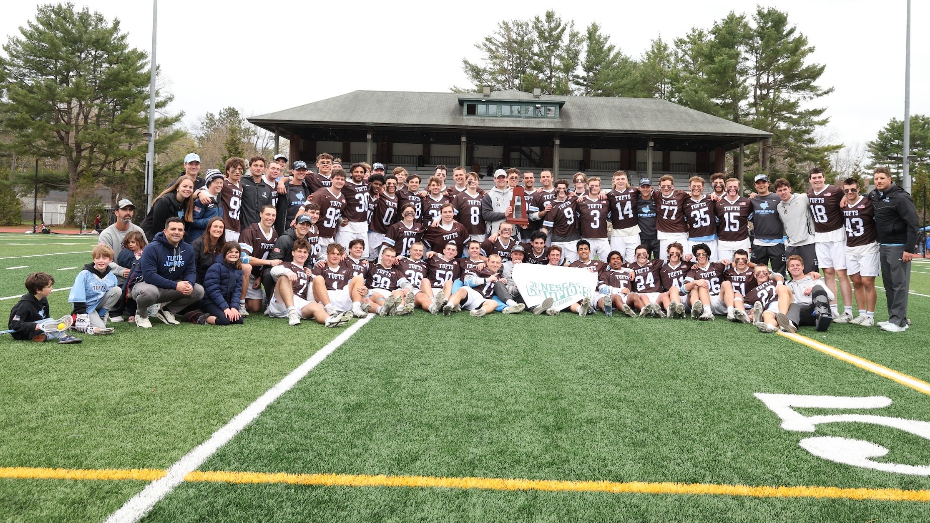 Tufts Men's Lacrosse Poses WIth NESCAC Title Trophy Sunday