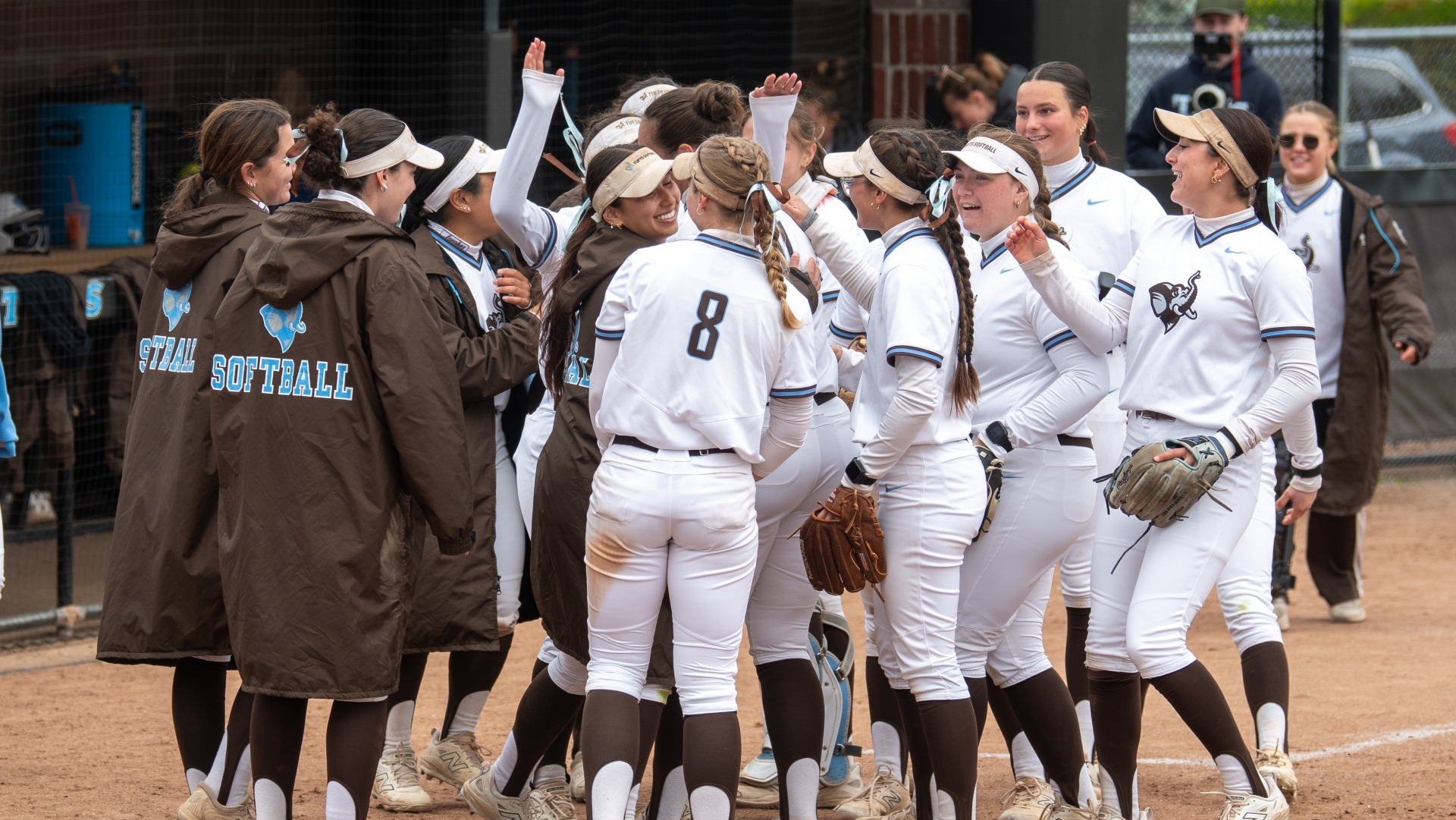 Tufts celebrates winning the NESCAC pennant on May 3.