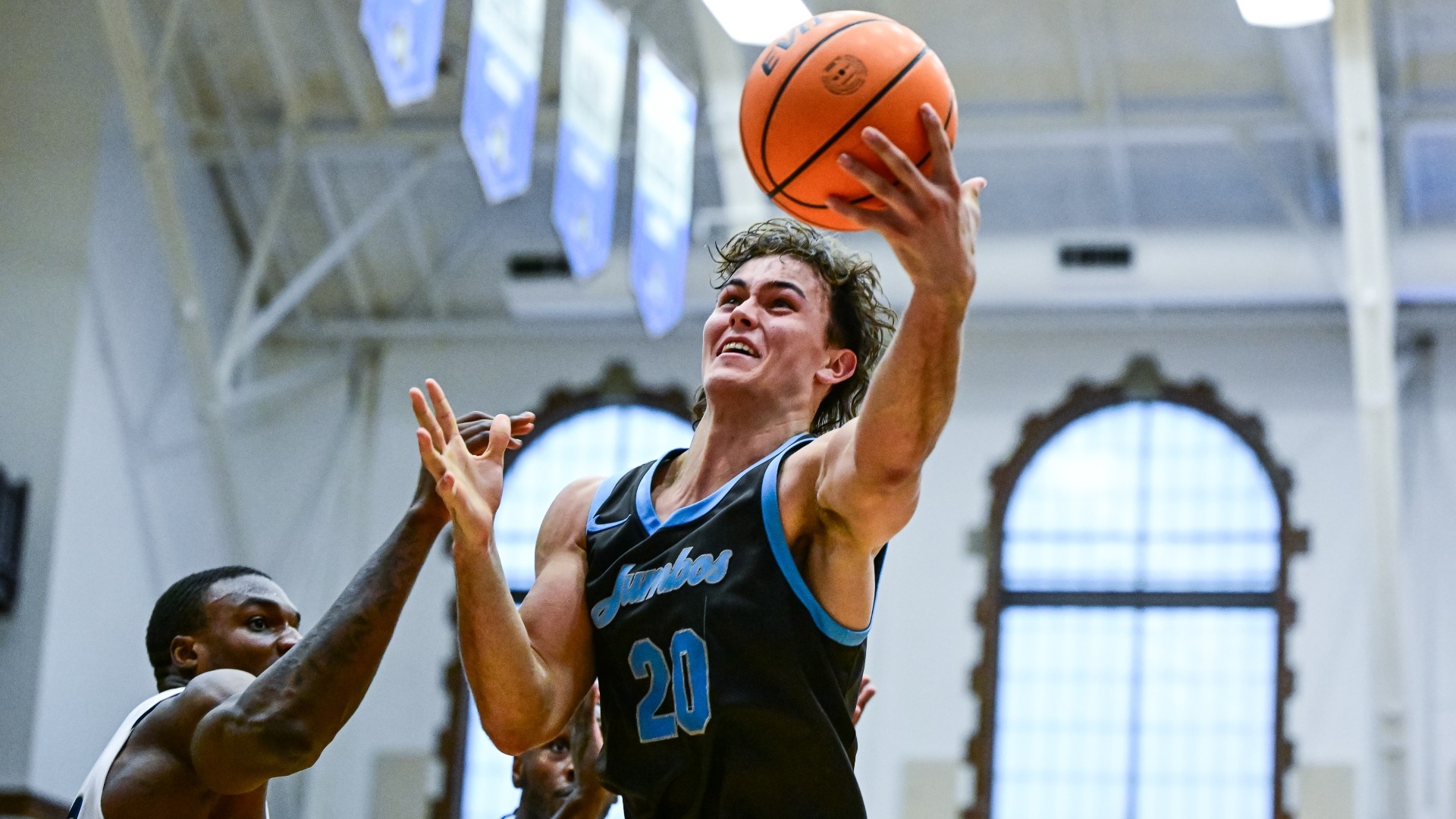Scott Gyimesi drives to the basket against Connecticut College.
