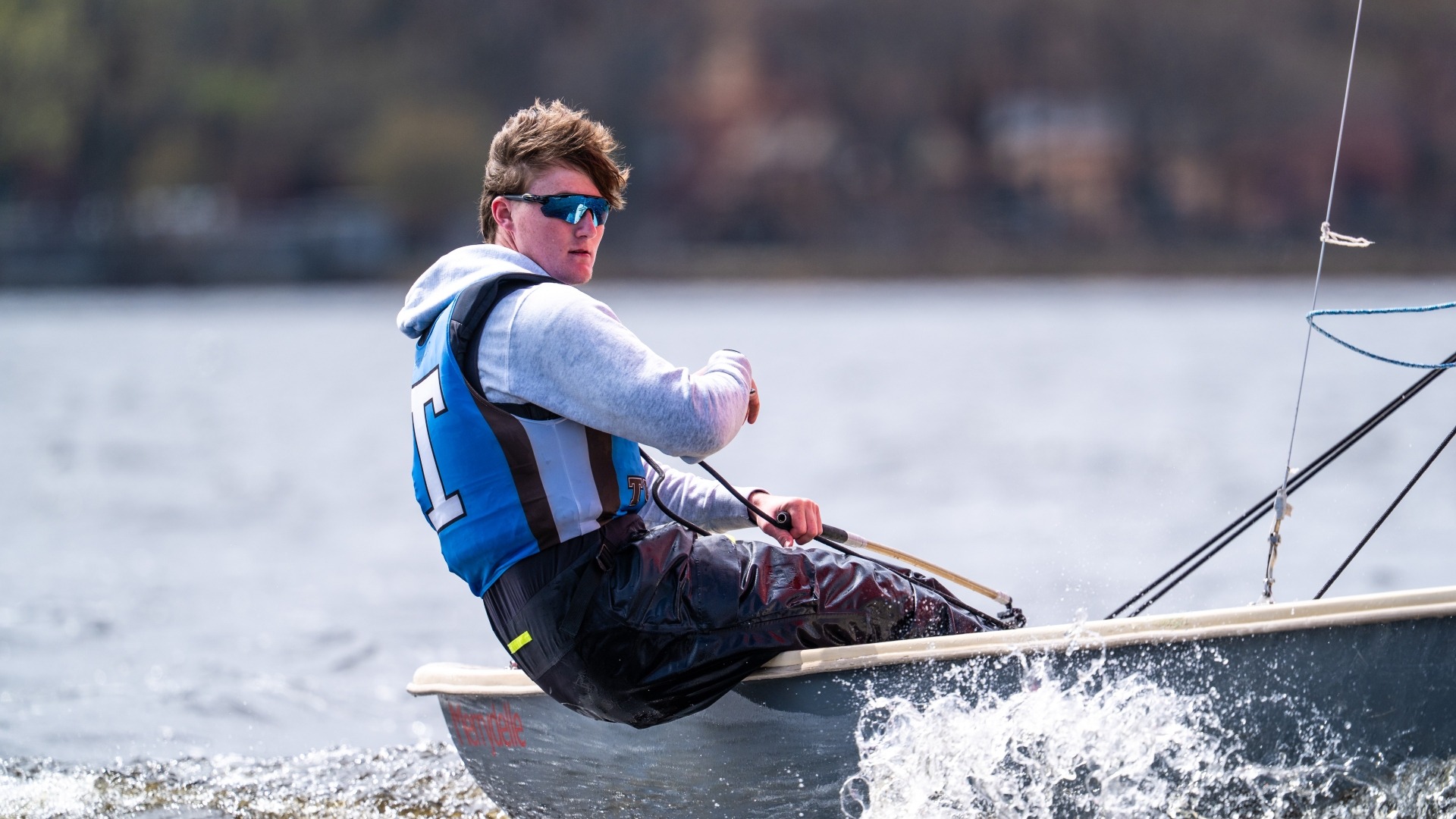 Brayden Benesch practices single-hand sailing on Upper Mystic Lake.