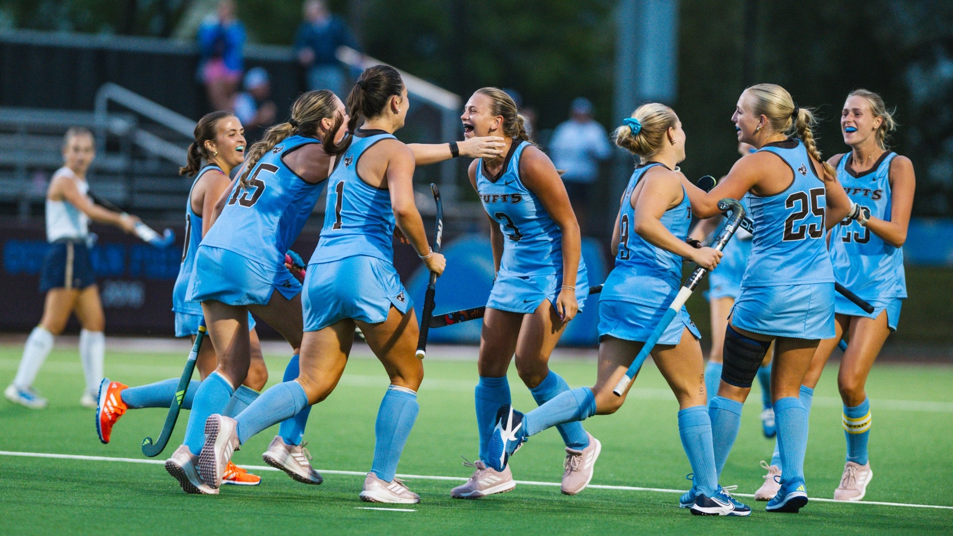 Tufts celebrates one of its five goals against Trinity College on opening night