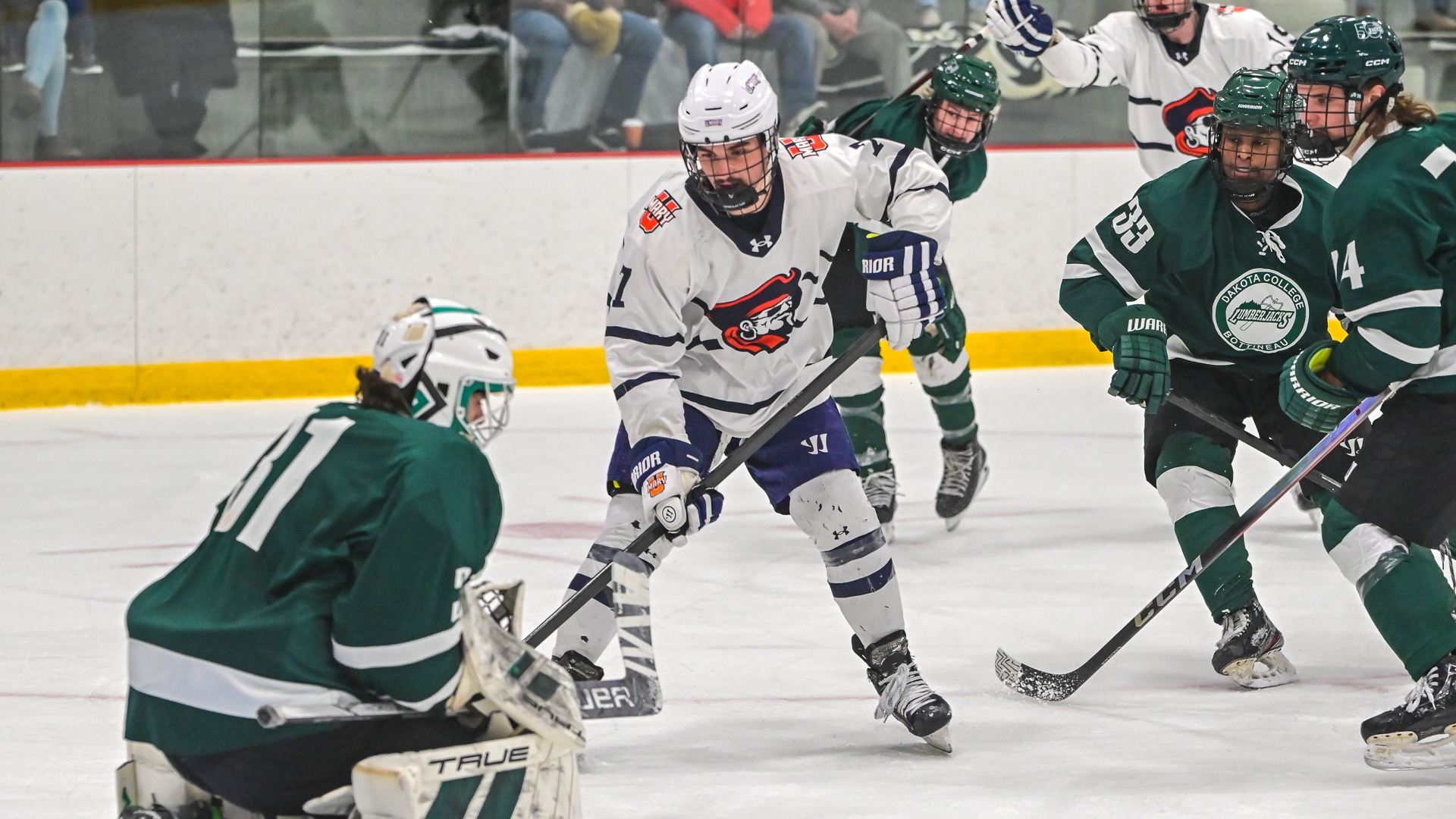 Alex Senf looks for the puck in front of the net