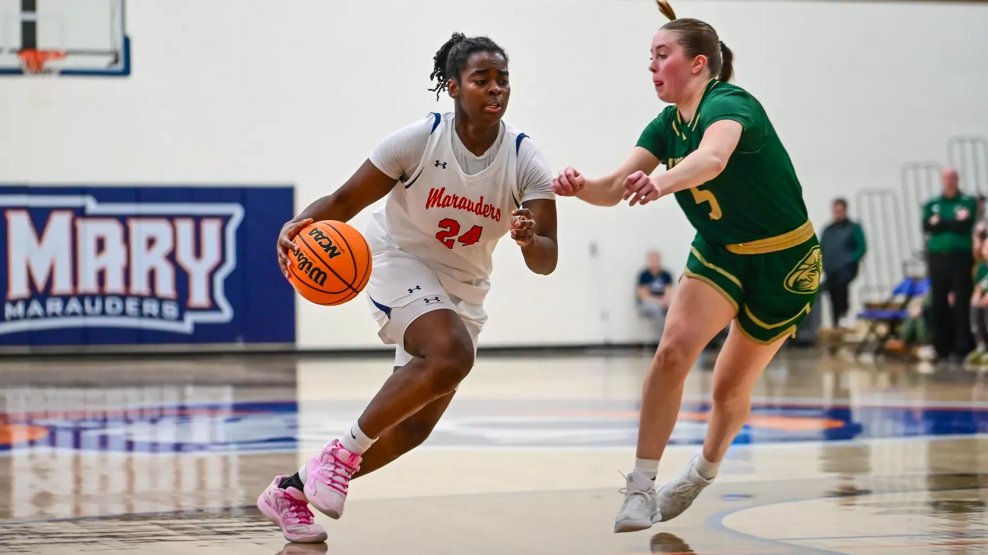 Grace Richardson drives past defender