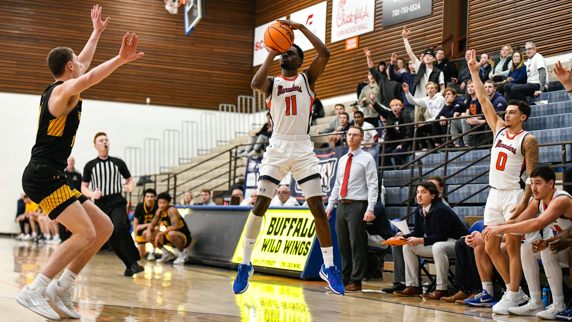 Tshawn Bois rises for a three in front of the home bench