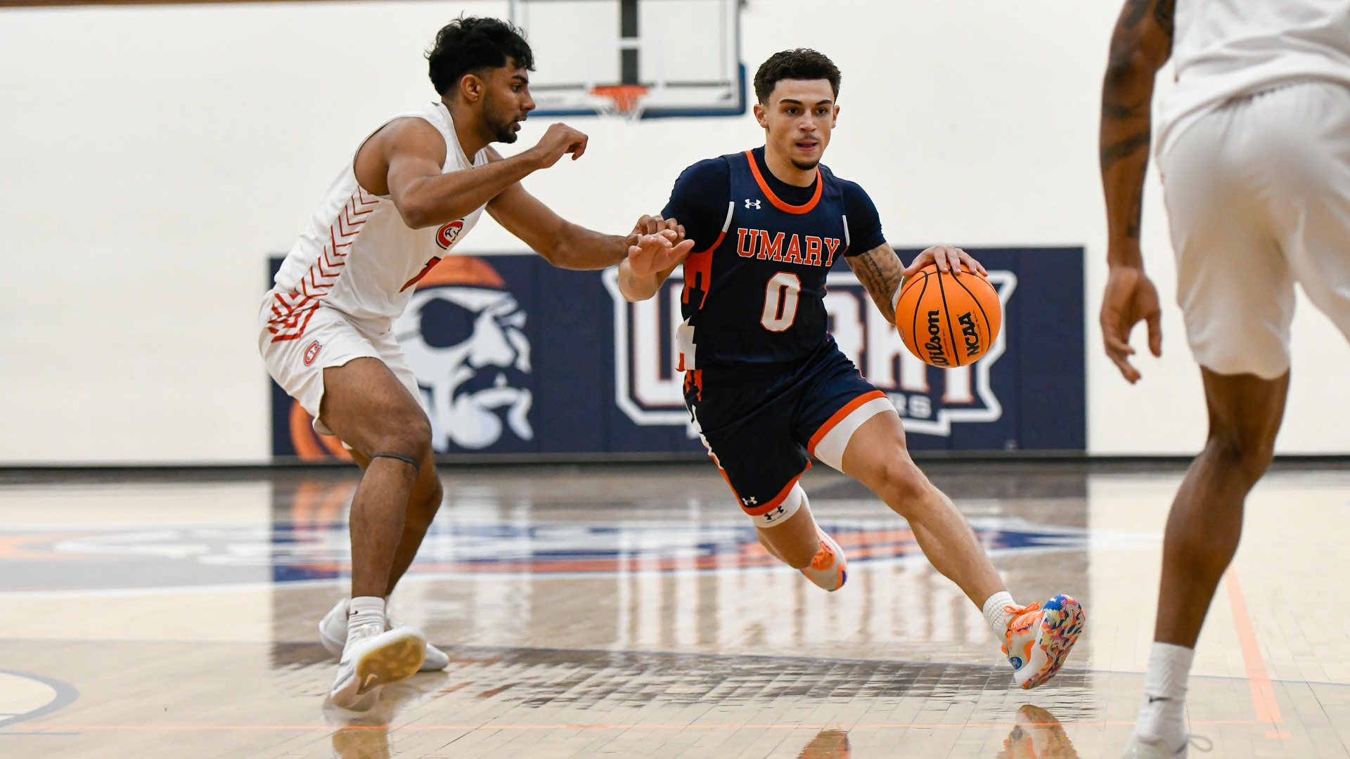 Alex Dvorak drives on the defender