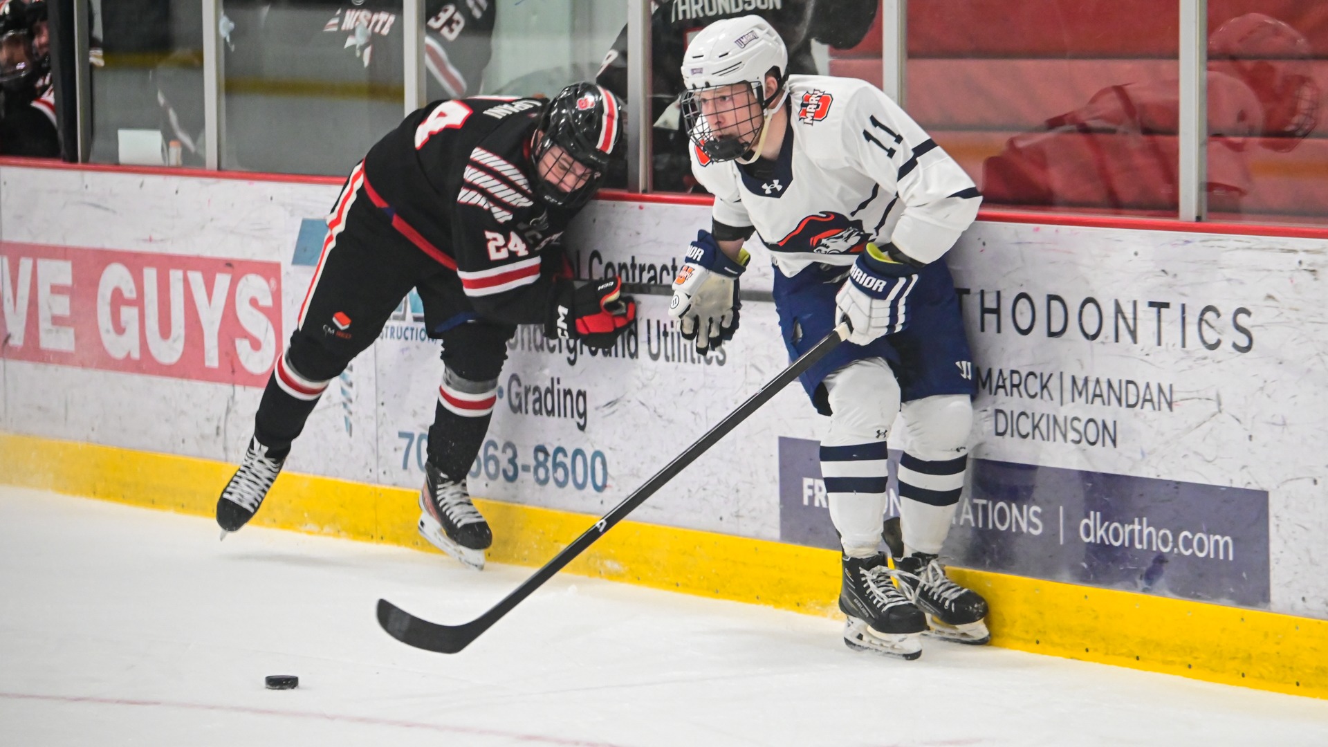 Ben Tschida along the boards