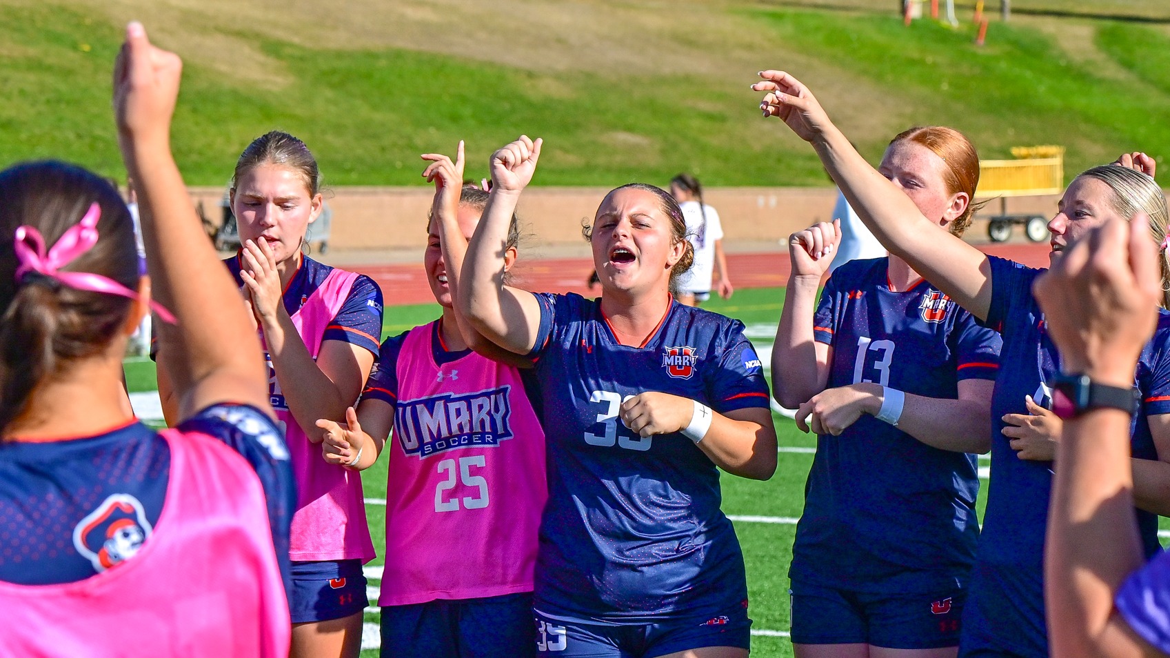 Team sings fight song postgame