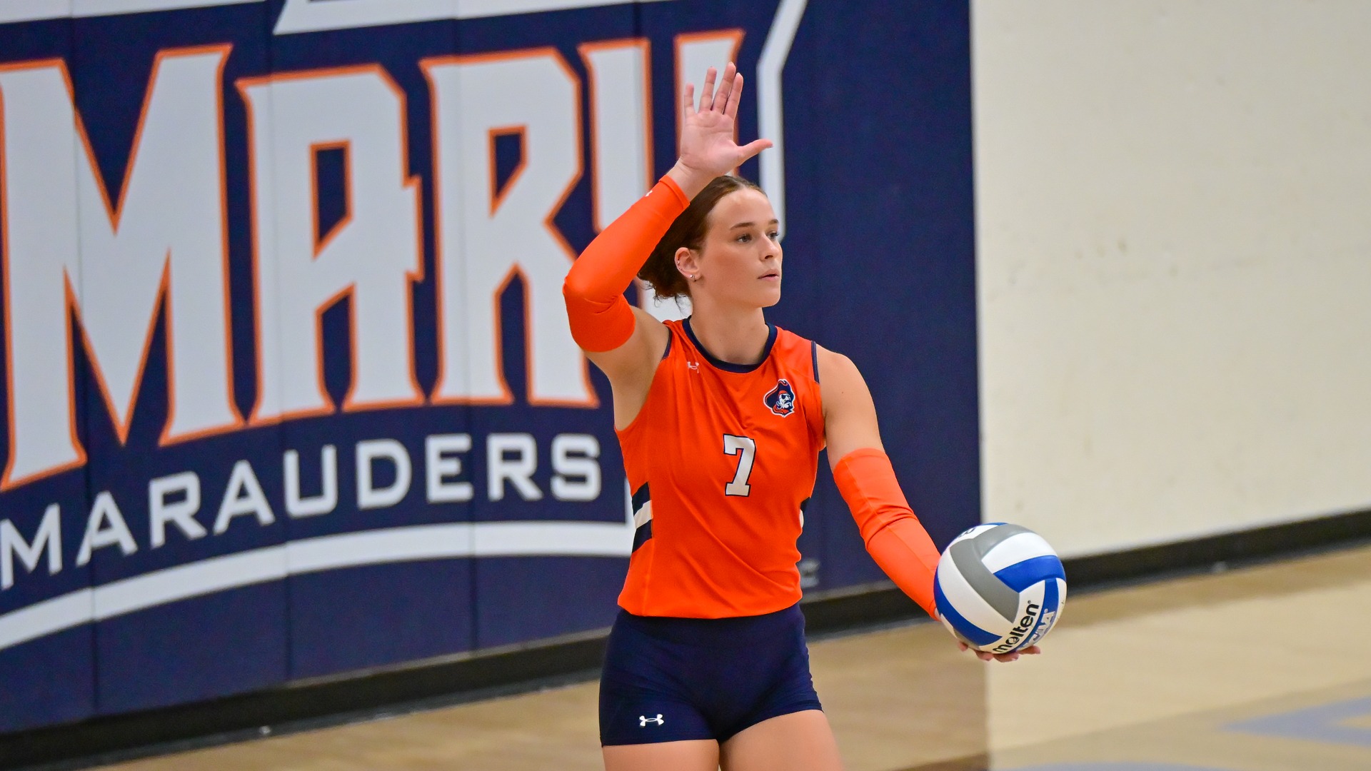 Holli Klettheimer preparing to serve