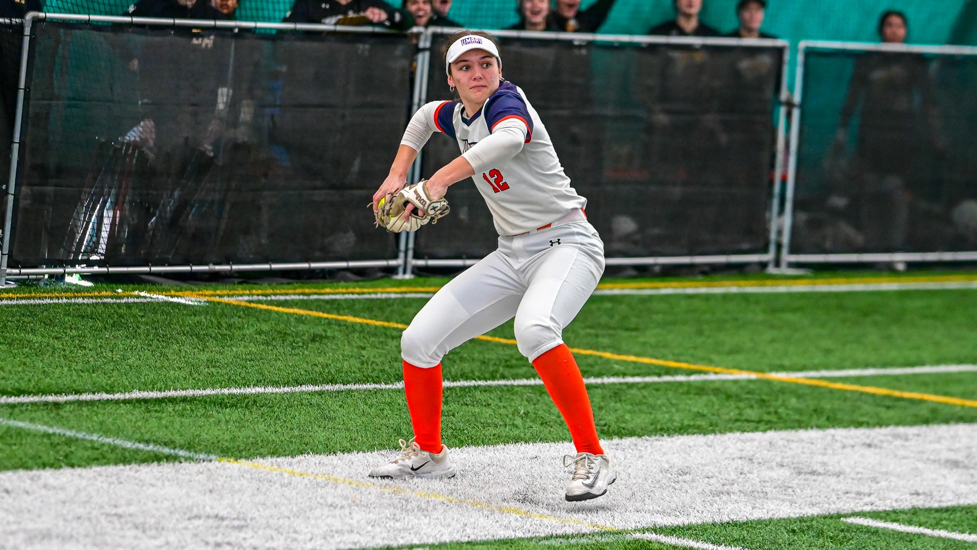 Daisy Sparrow throwing to first