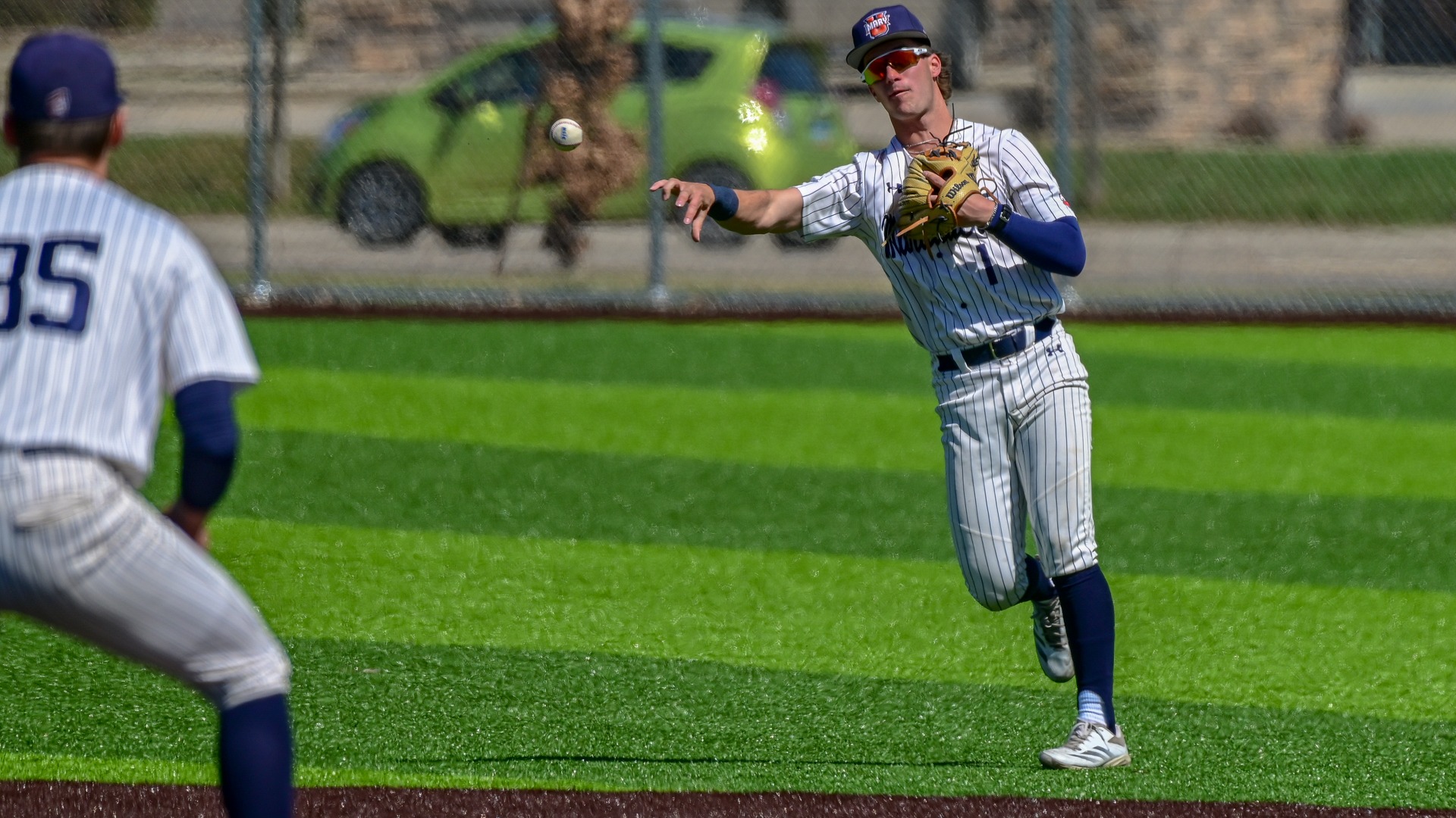 Cullen Wilson fires to first for out from short right field