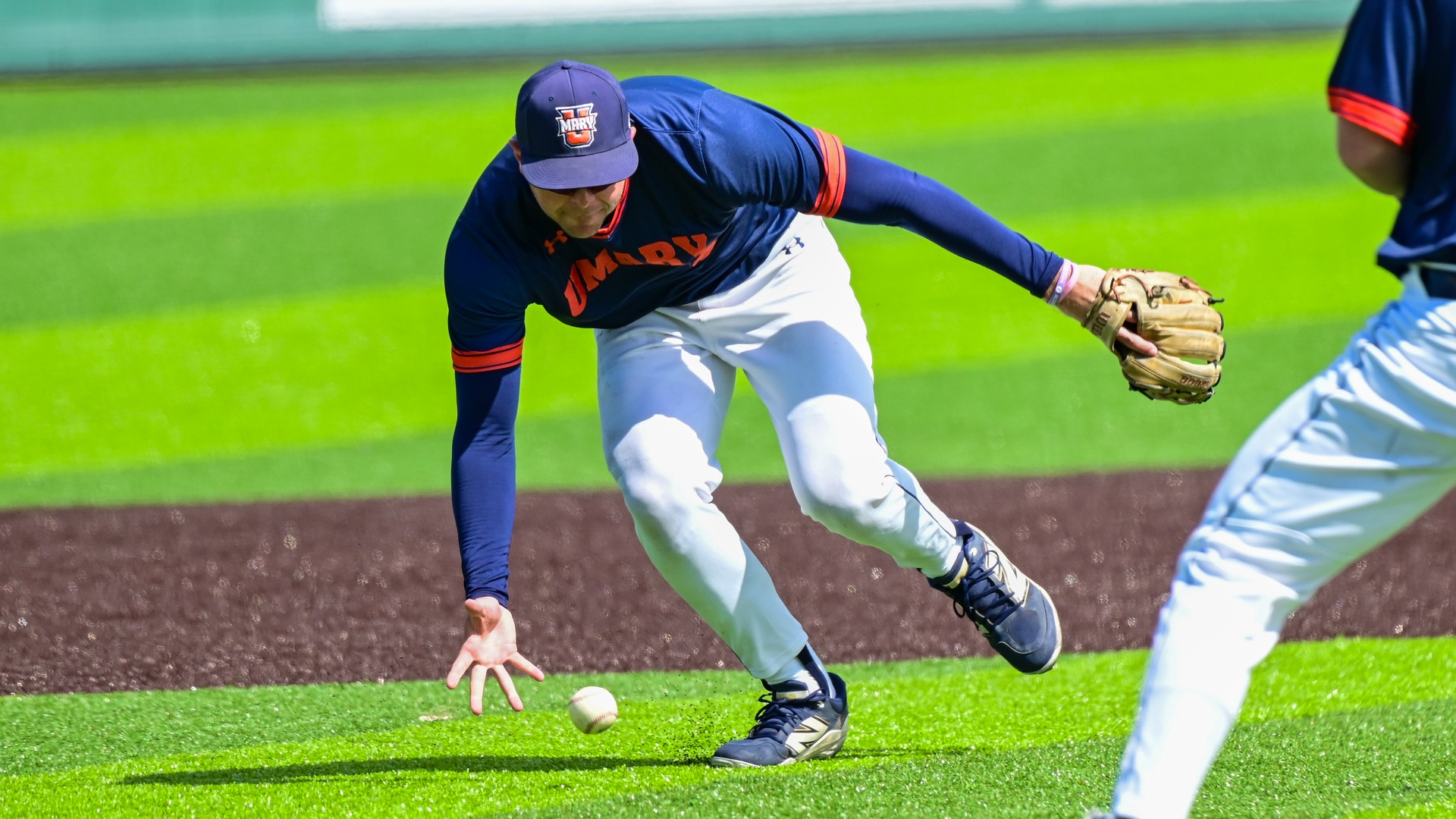Kieran Gaffney goes to barehand the grounder