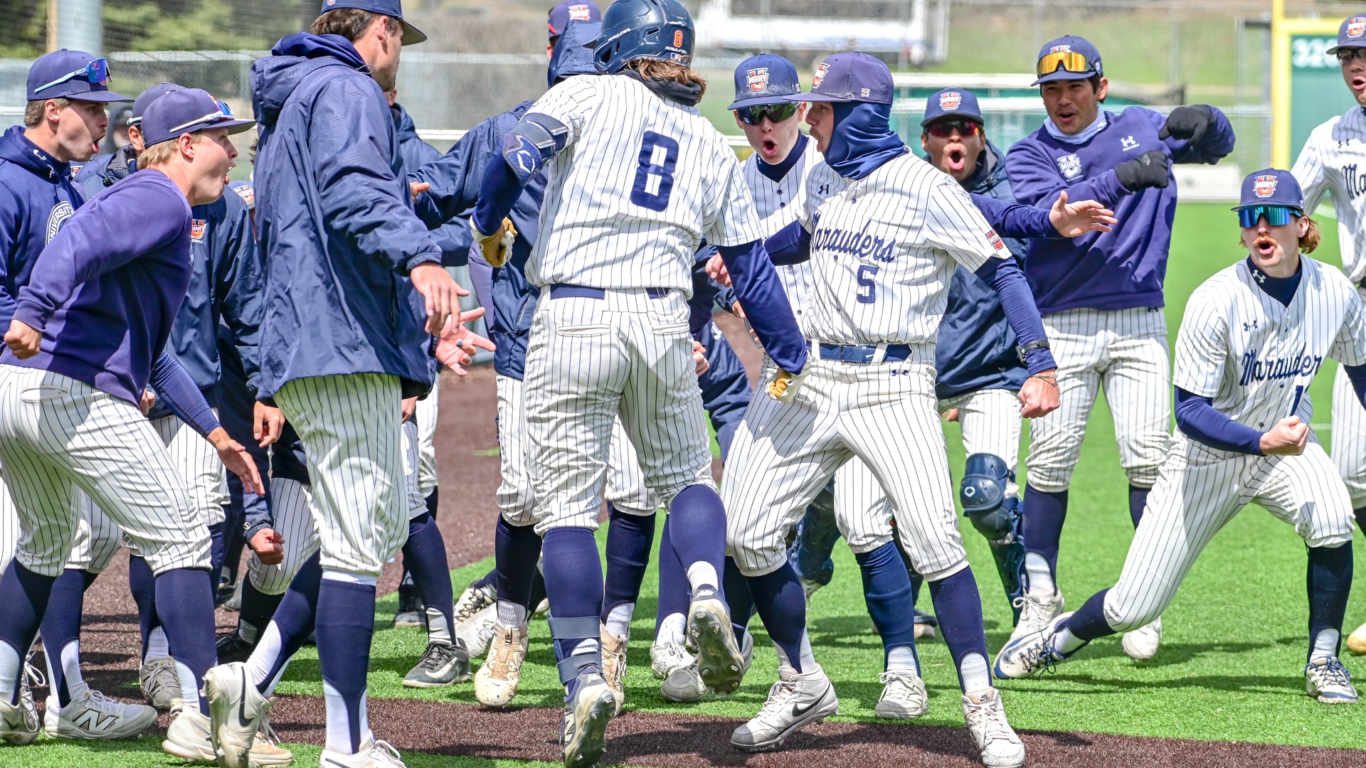 Marauders celebrate an Isaac Pegors home run