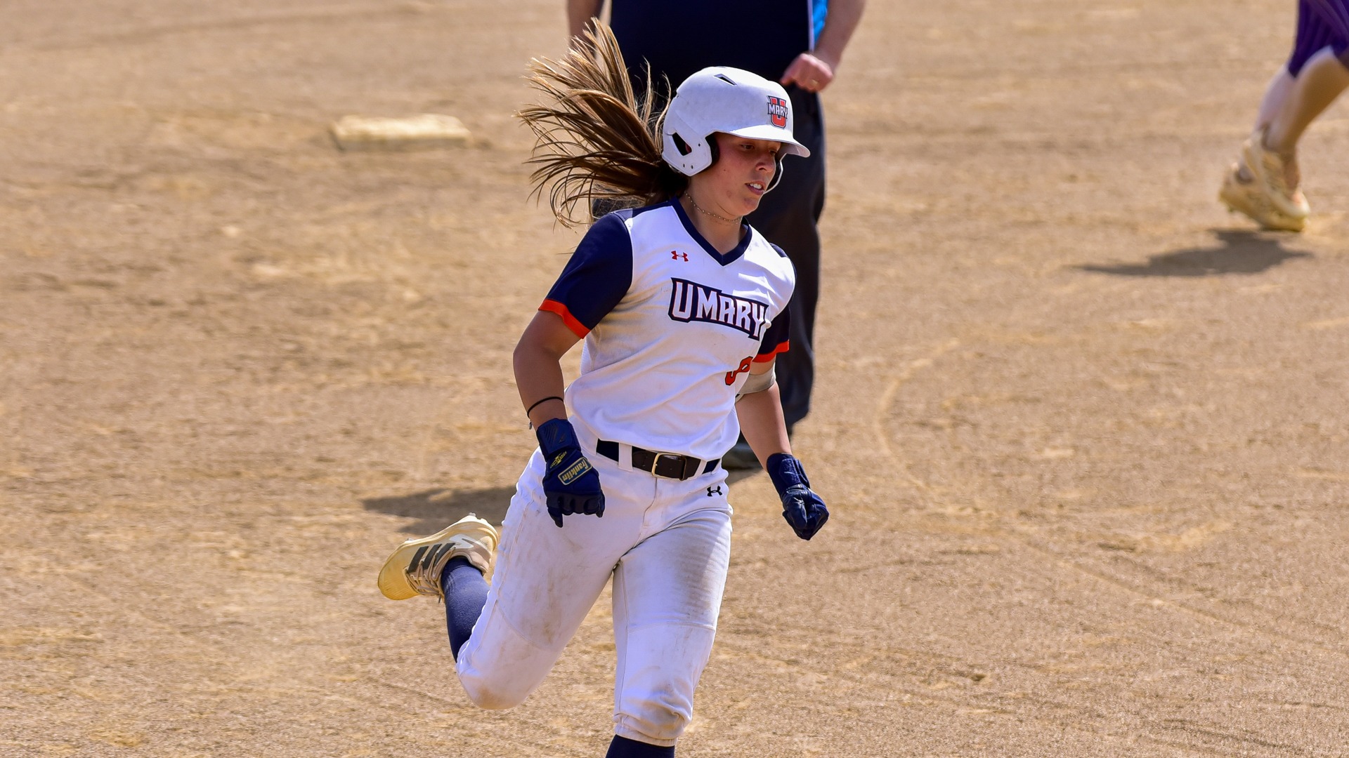 Genevieve Hastings rounding the bases after a home run