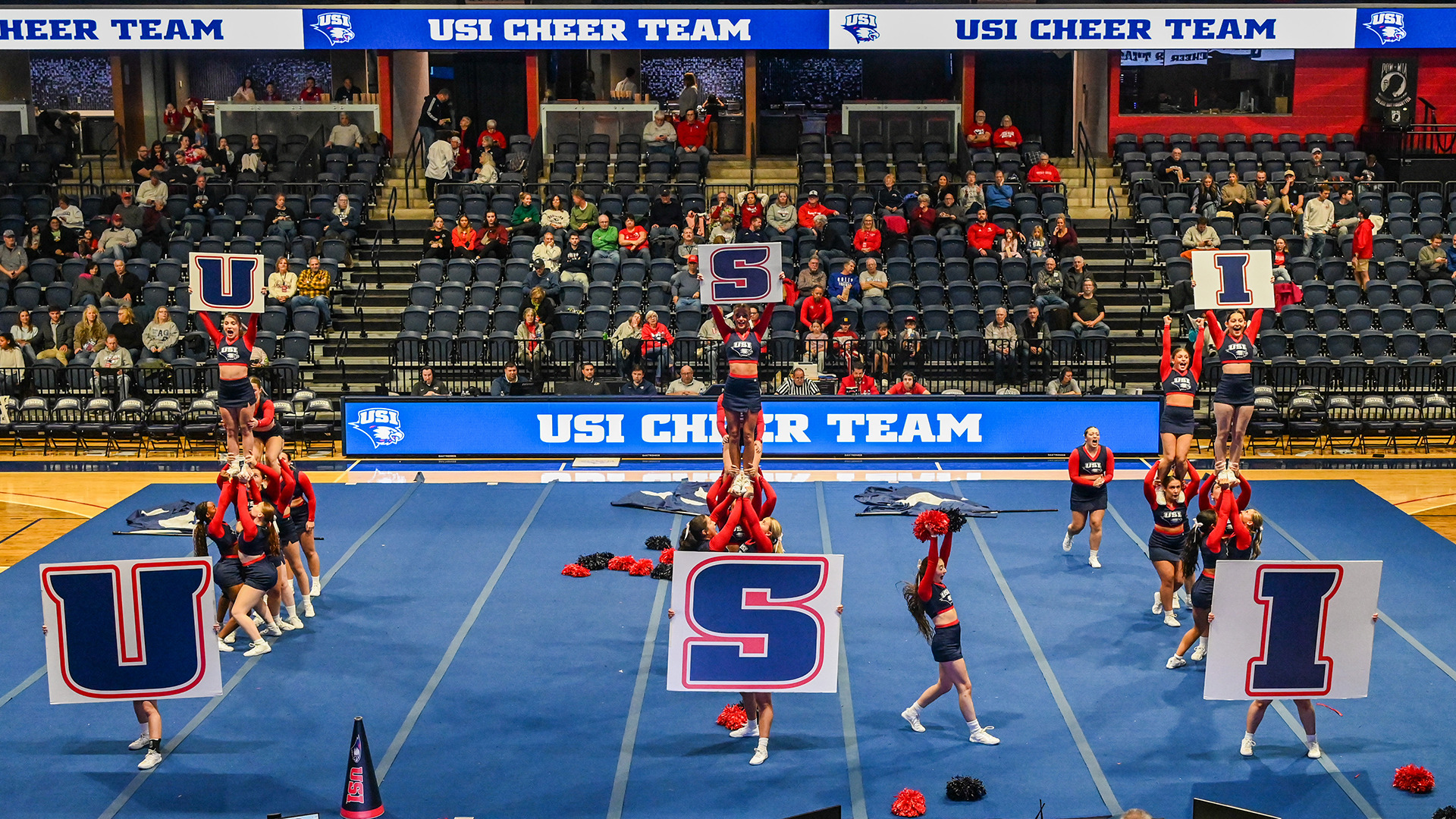 2025-26 USI Cheer Team performs its Game Day routine during a basketball game.